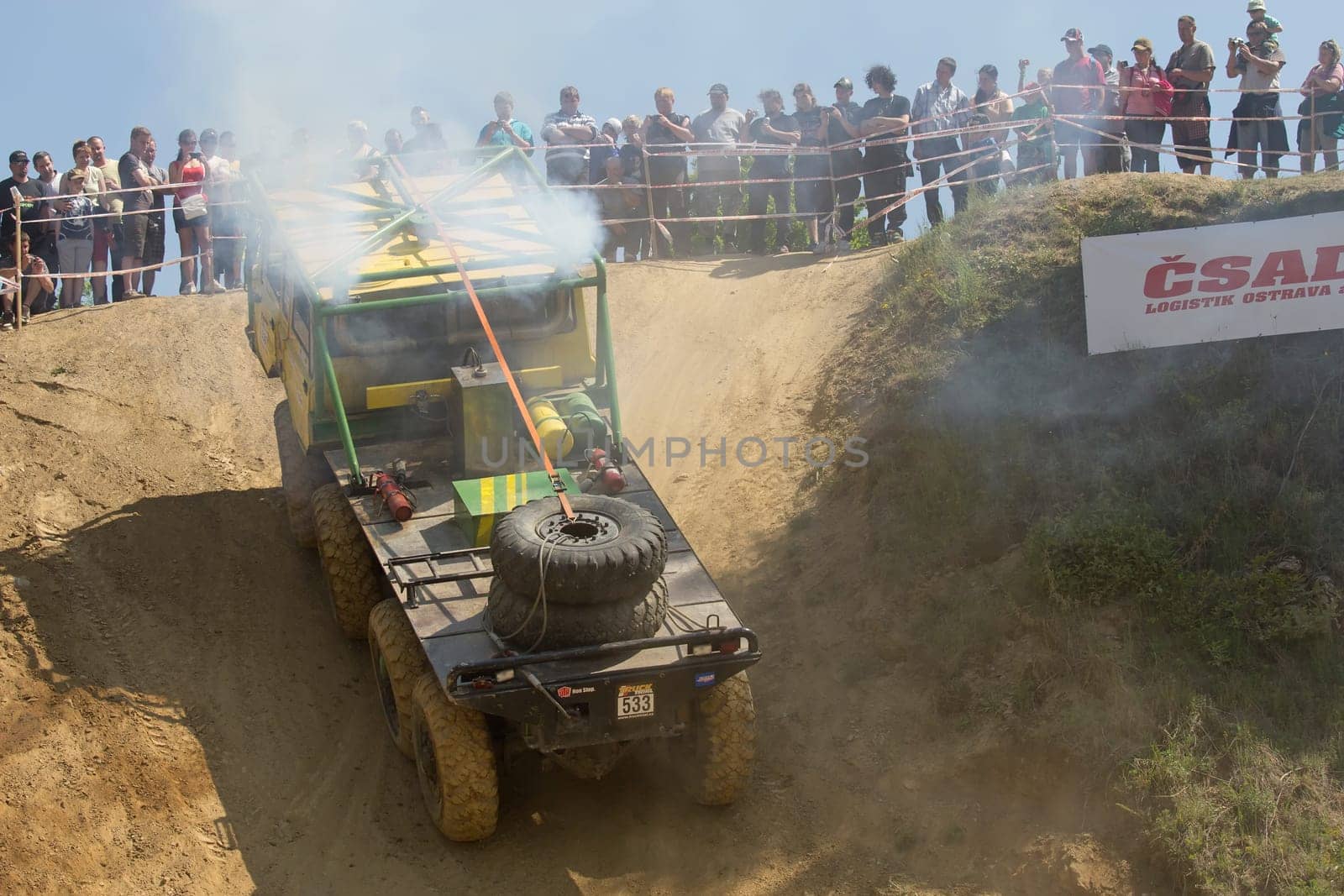MOHELNICE, CZECH REPUBLIC - MAY 20. Unidentified racer leaves steep slope in the "Grand Prix Truck Trial 2012"" on May 20, 2012 in the town of Mohelnice, Czech Republic."