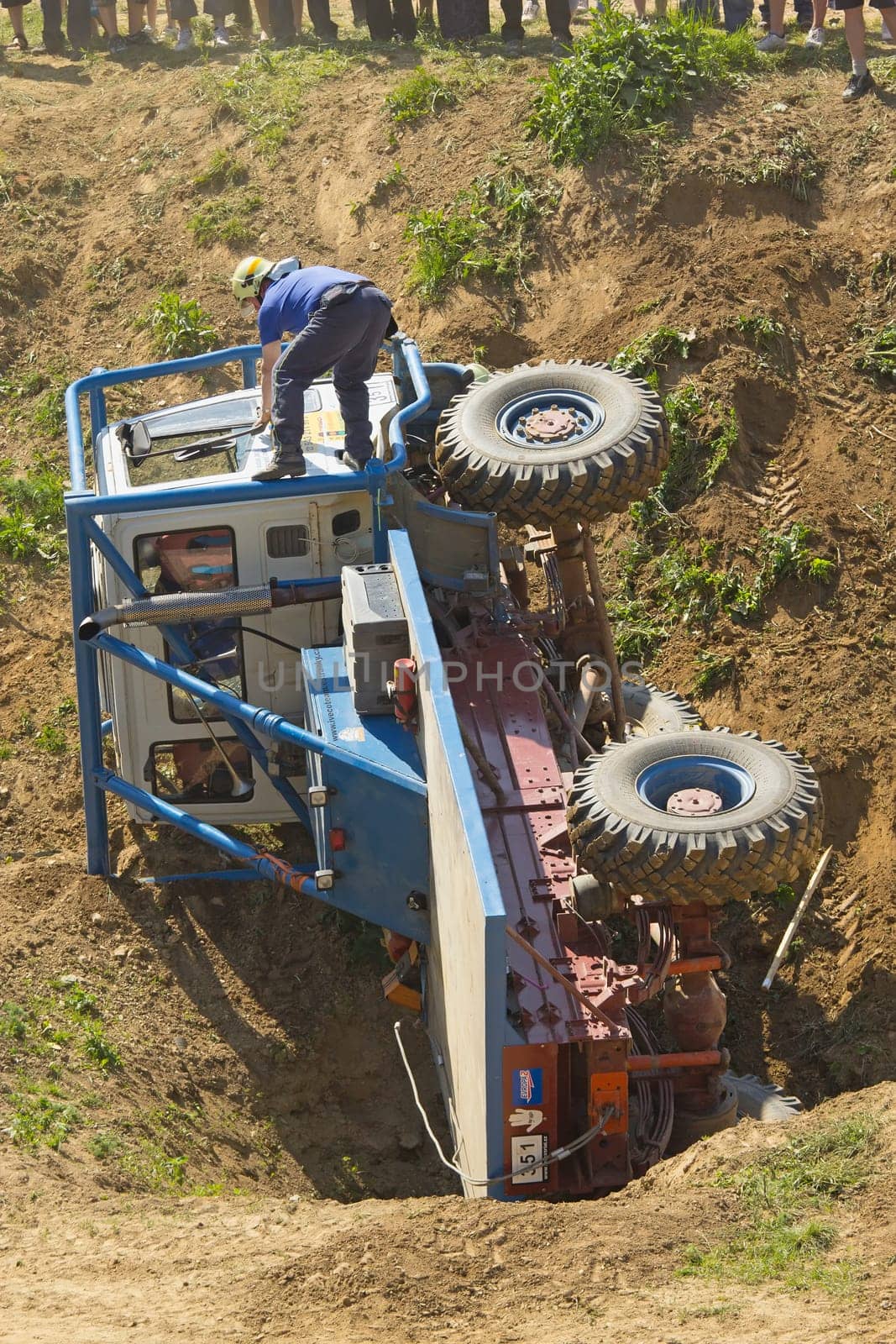 MOHELNICE, CZECH REPUBLIC - MAY 20. Unidentified racer flipped his truck on its side in the "Grand Prix Truck Trial 2012"" on May 20, 2012 in the town of Mohelnice, Czech Republic."