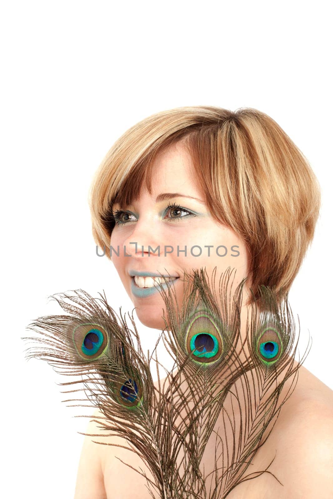 Young woman with peacock feather