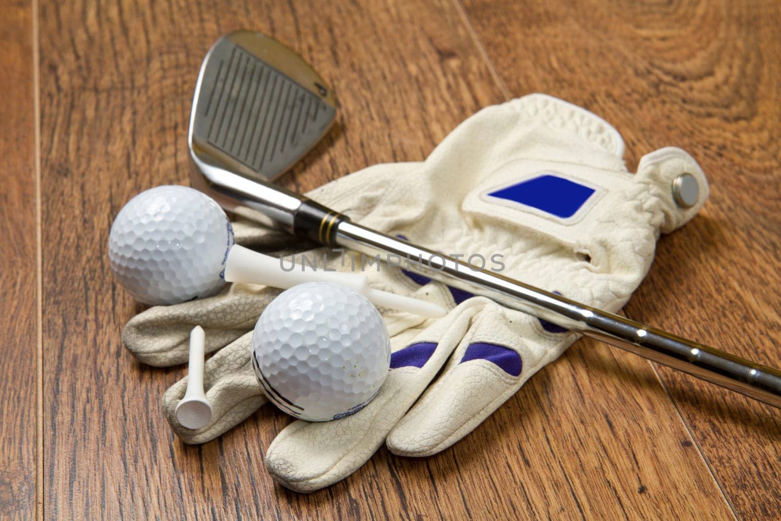 golf equipment on wooden table