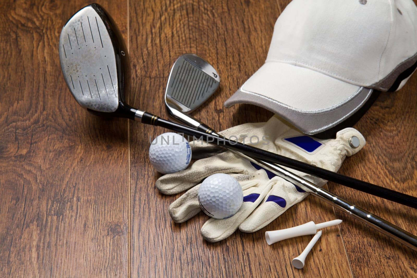golf equipment on wooden table