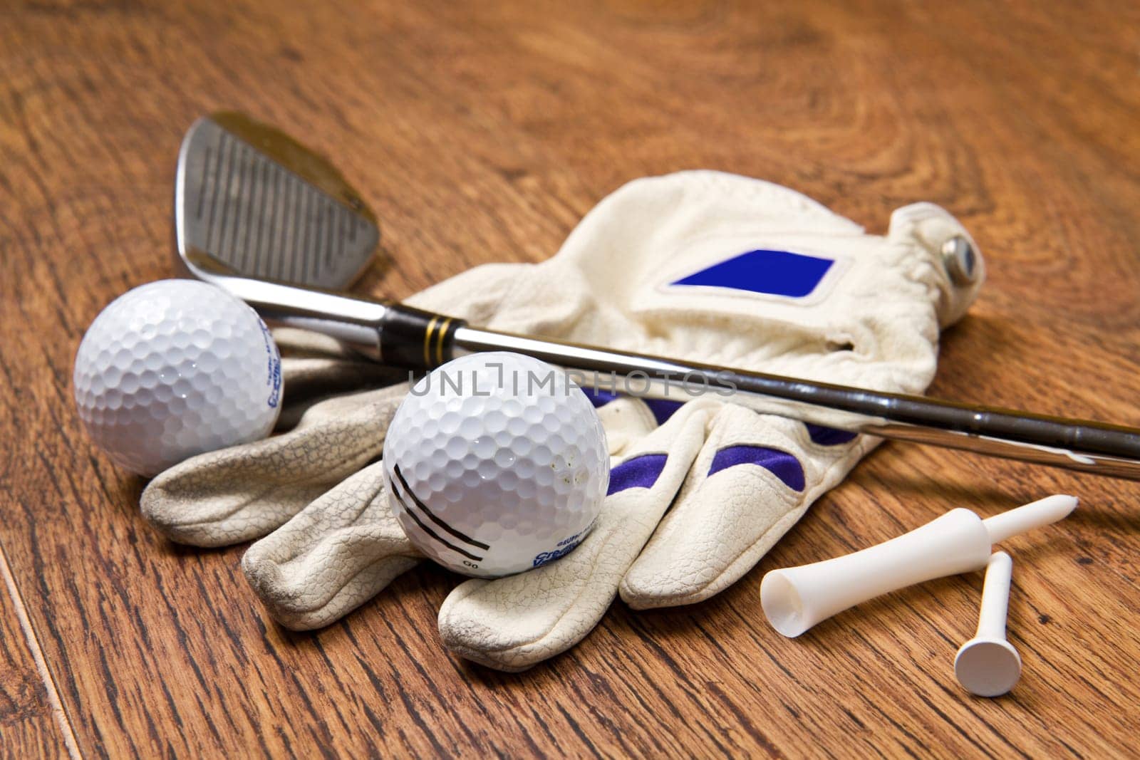 golf equipment on wooden table
