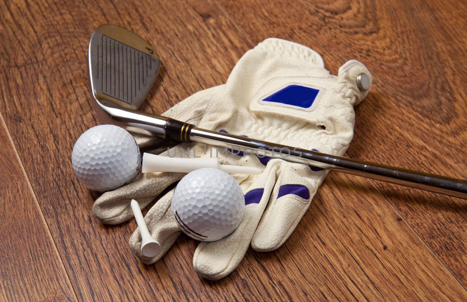 golf equipment on wooden table