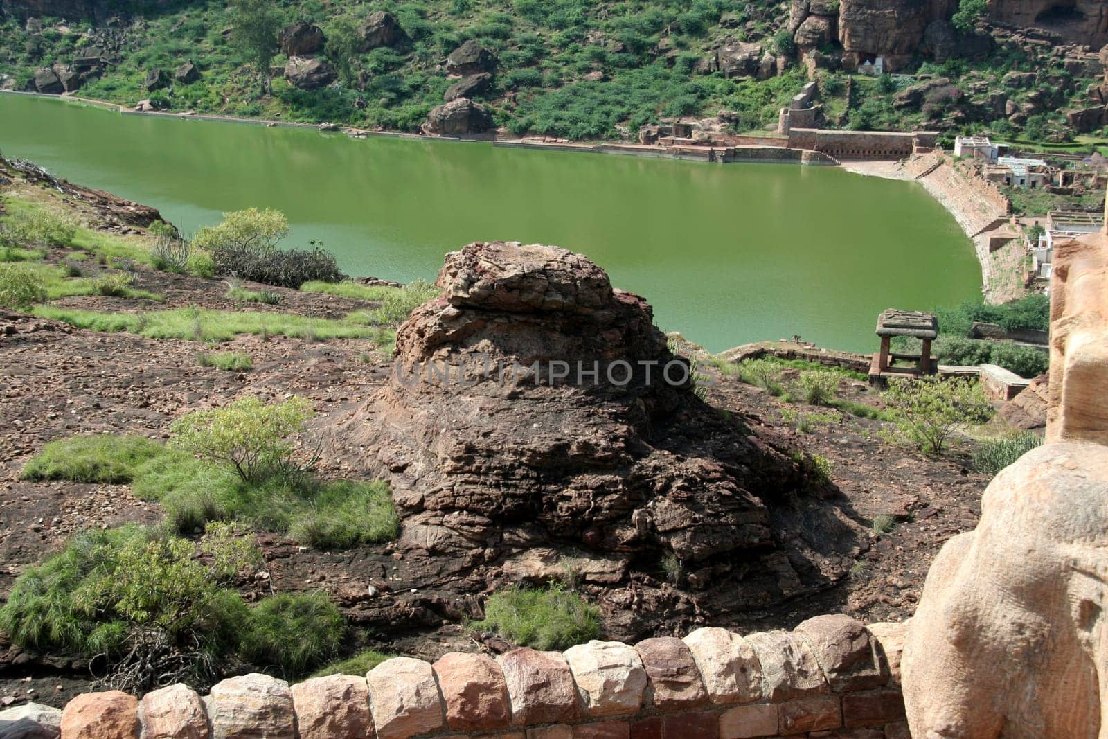 View of rock and Lake Agusthya Teertha from northern hill at Badami, Karnataka, India, Asia