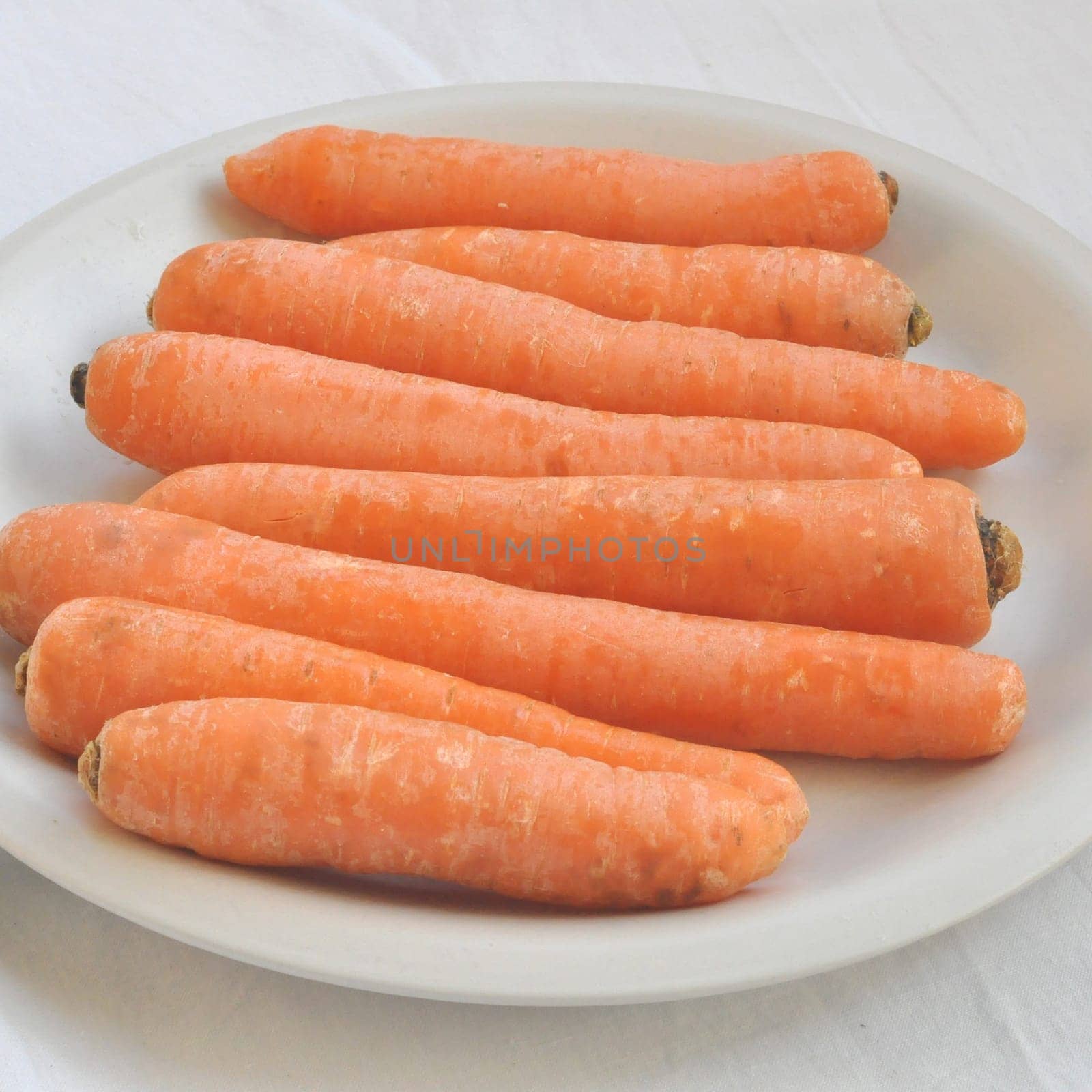 Orange carrot slices useful as a background