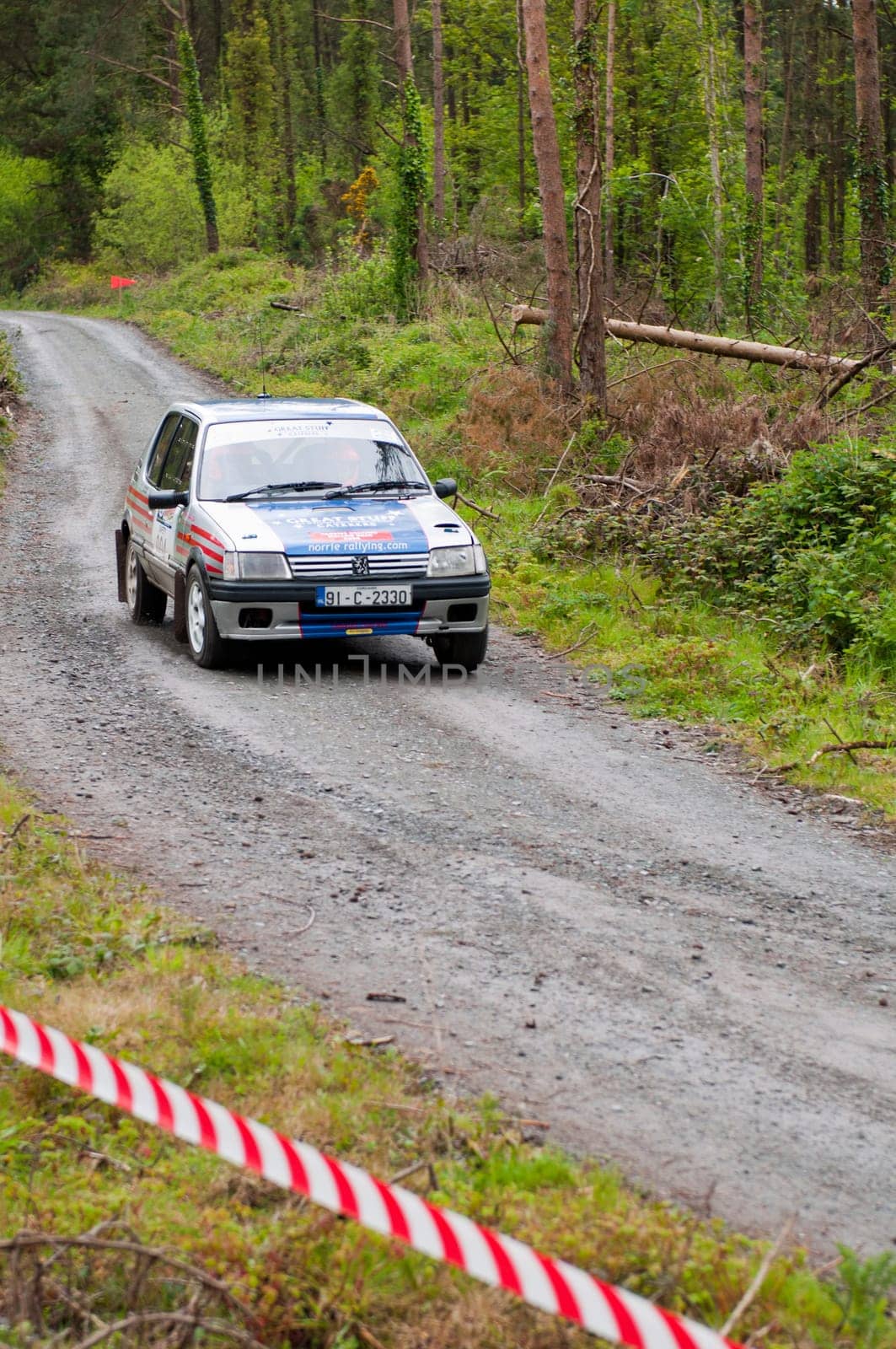 MALLOW, IRELAND - MAY 19: I. Downey driving Opel Corsa at the Jim Walsh Cork Forest Rally on May 19, 2012 in Mallow, Ireland. 4th round of the Valvoline National Forest Rally Championship.