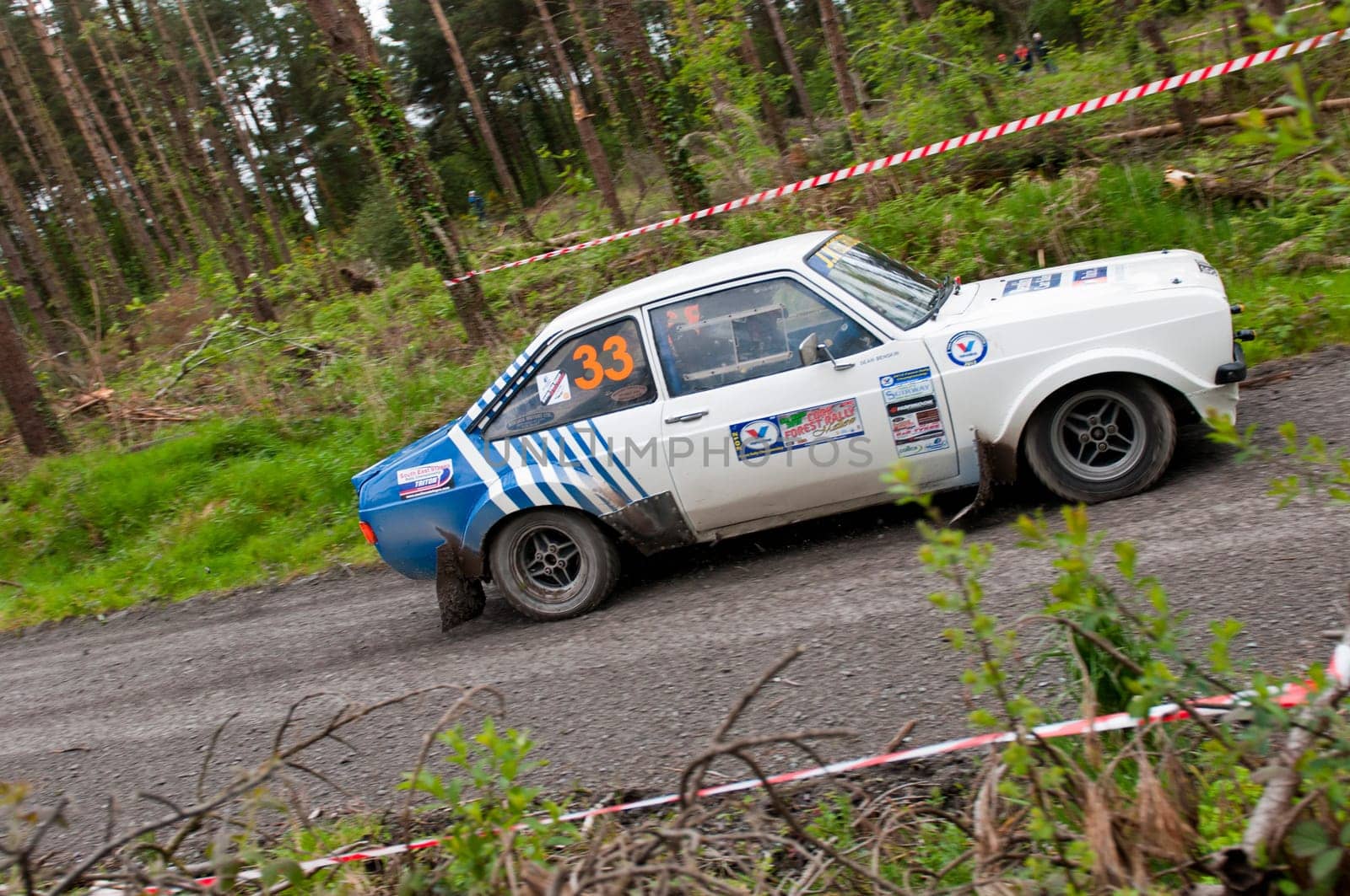 MALLOW, IRELAND - MAY 19: S. Benskin driving Ford Escort at the Jim Walsh Cork Forest Rally on May 19, 2012 in Mallow, Ireland. 4th round of the Valvoline National Forest Rally Championship.