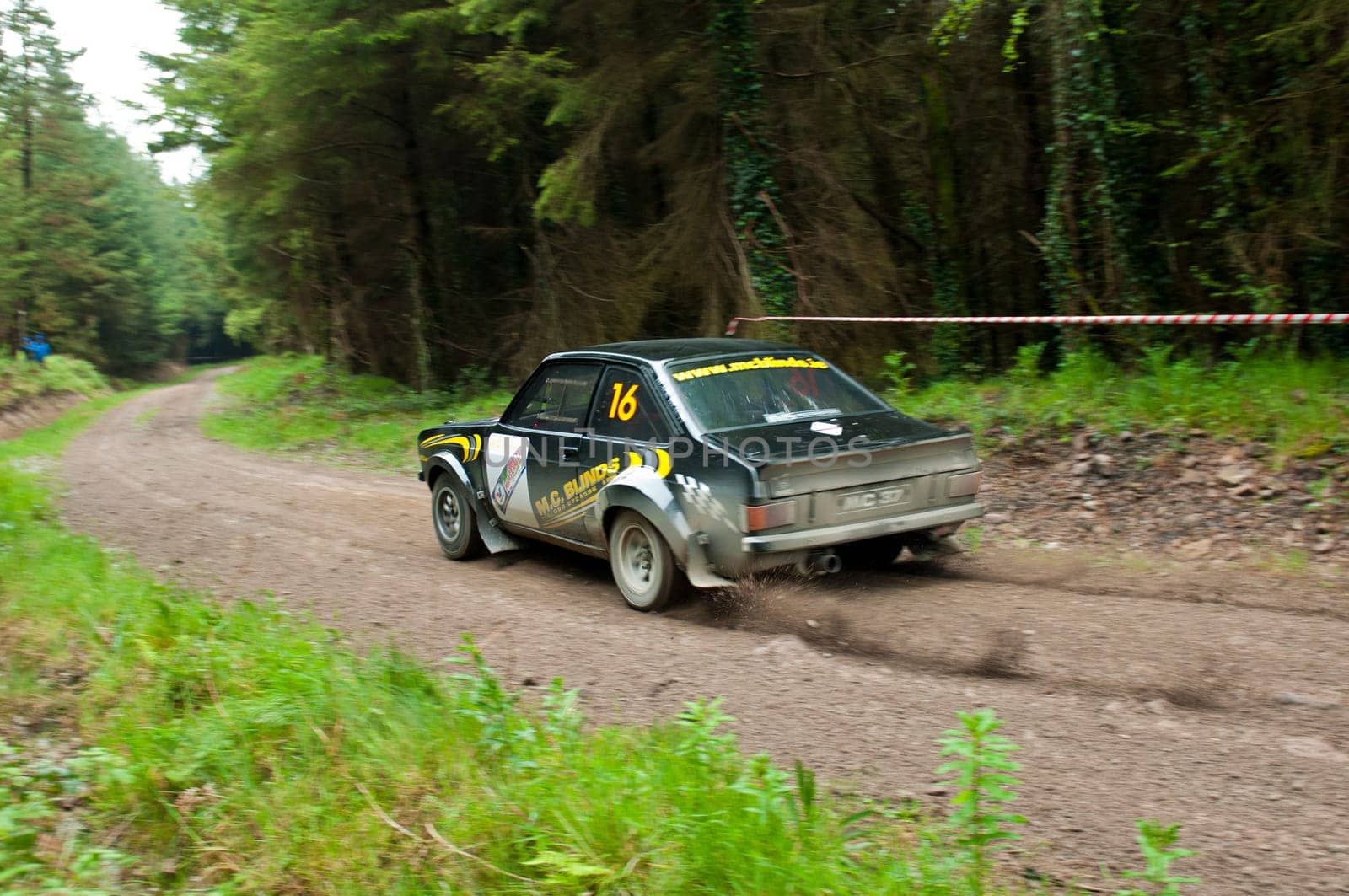 MALLOW, IRELAND - MAY 19: M. Conlon driving Ford Escort at the Jim Walsh Cork Forest Rally on May 19, 2012 in Mallow, Ireland. 4th round of the Valvoline National Forest Rally Championship.