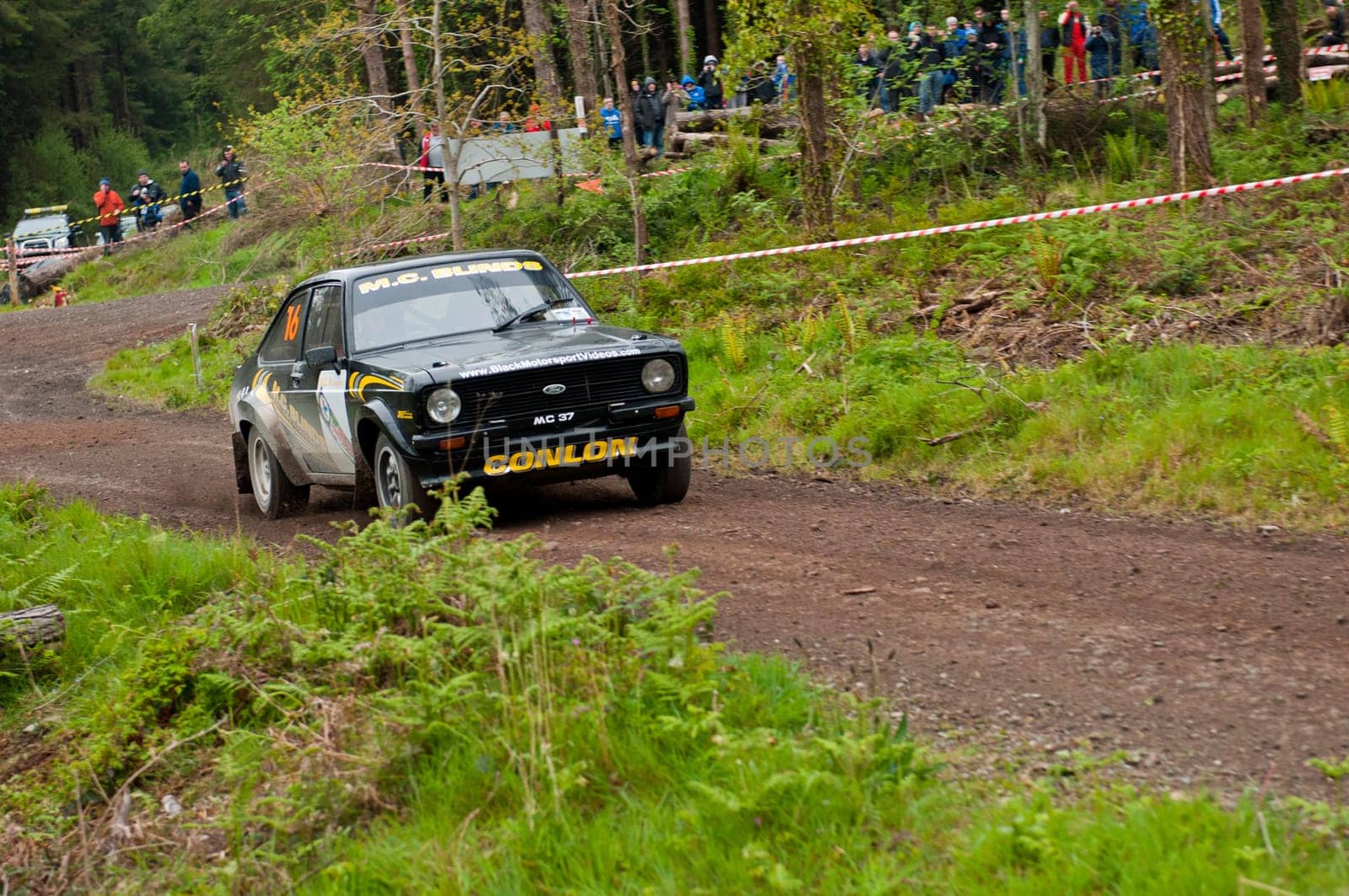 MALLOW, IRELAND - MAY 19: M. Conlon driving Ford Escort at the Jim Walsh Cork Forest Rally on May 19, 2012 in Mallow, Ireland. 4th round of the Valvoline National Forest Rally Championship.