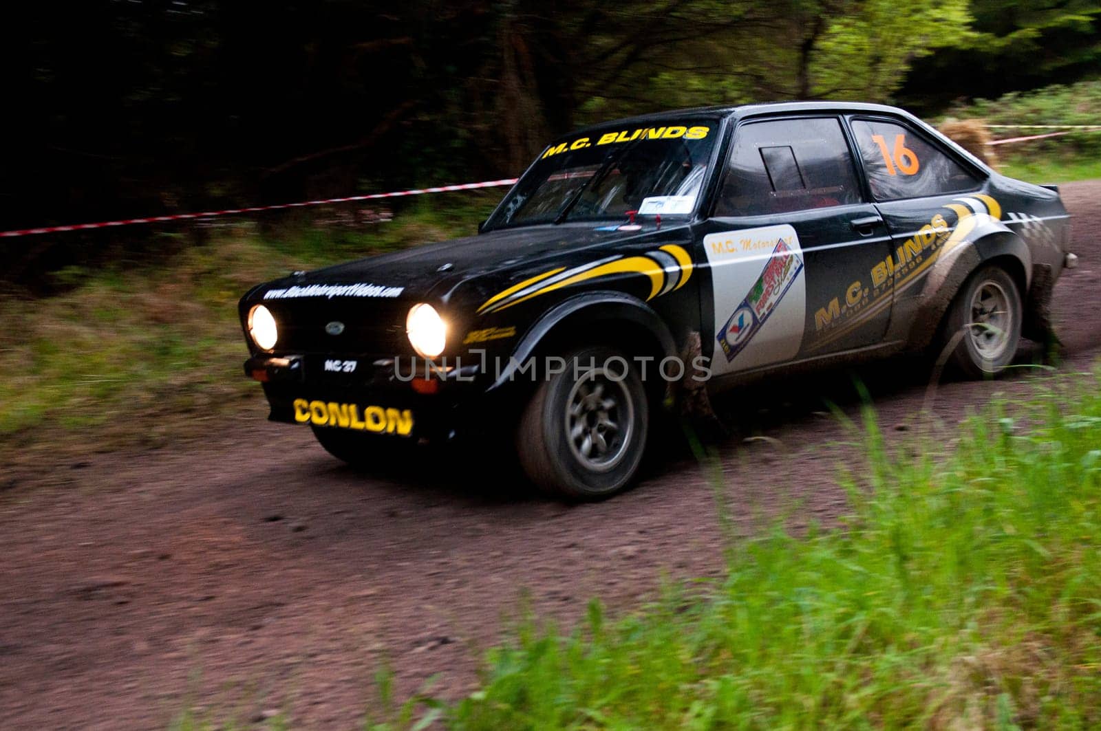 MALLOW, IRELAND - MAY 19: M. Conlon driving Ford Escort at the Jim Walsh Cork Forest Rally on May 19, 2012 in Mallow, Ireland. 4th round of the Valvoline National Forest Rally Championship.
