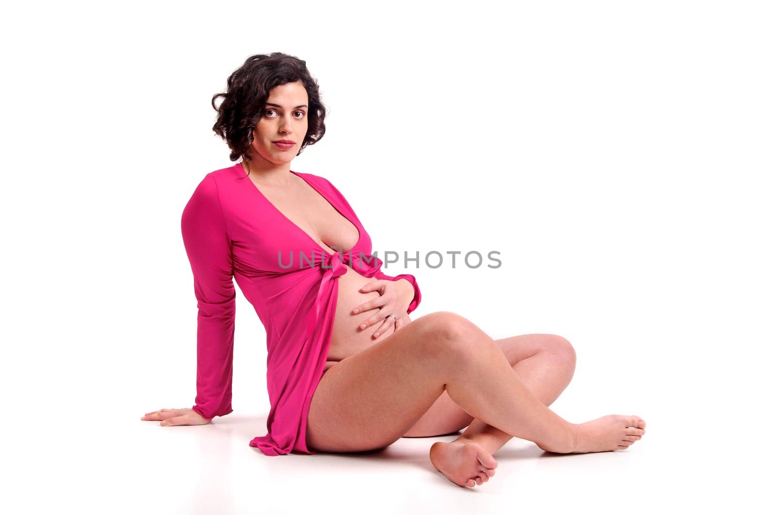 Beautiful pregnant woman with pink shirt