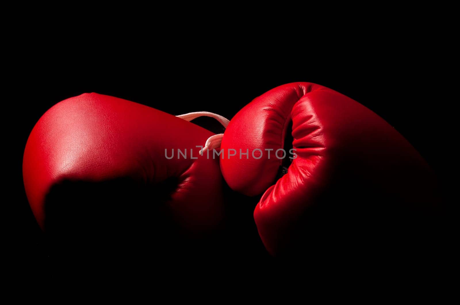 Boxing gloves against a black backgroud