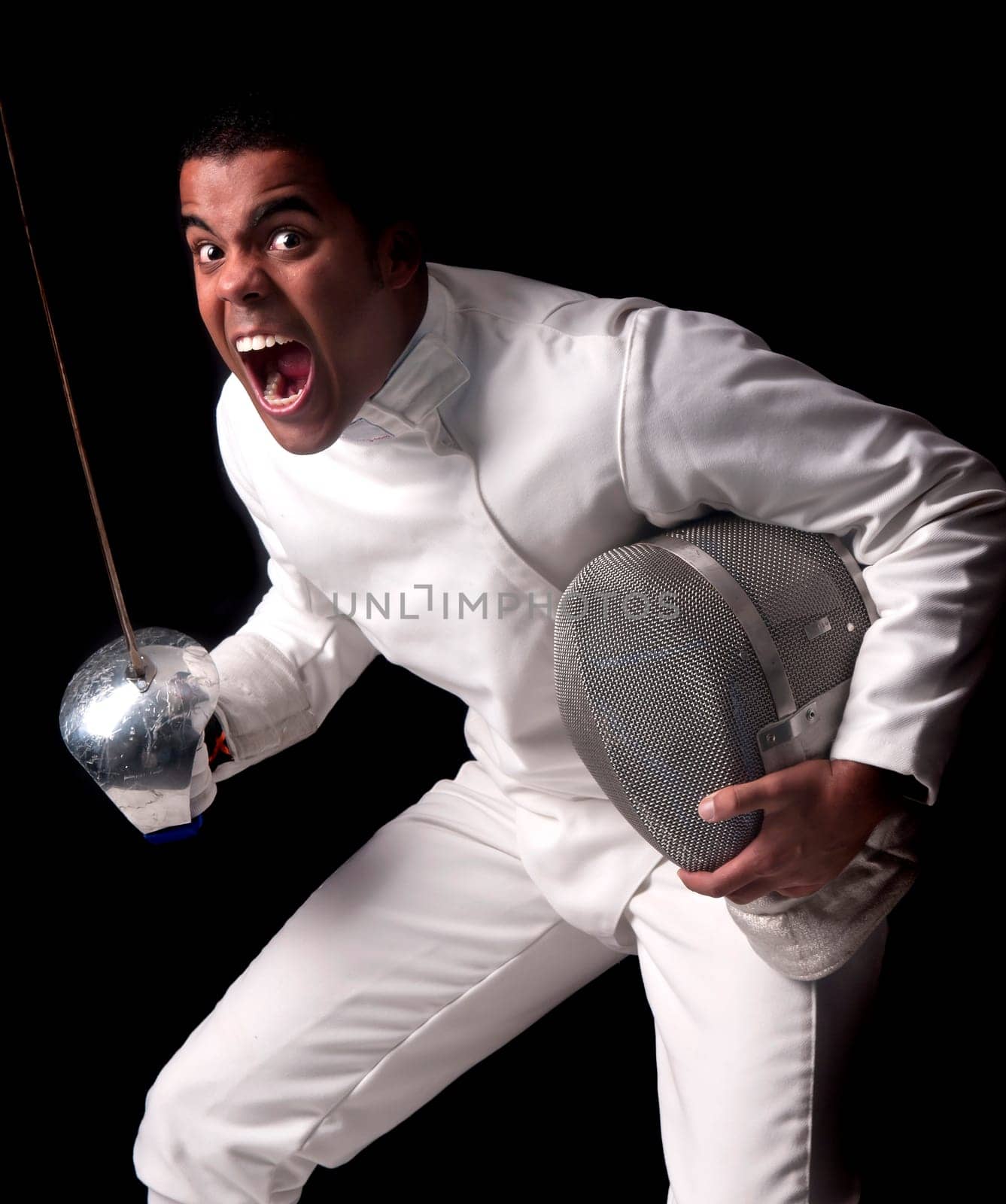 Male fencer isolated in a dark background