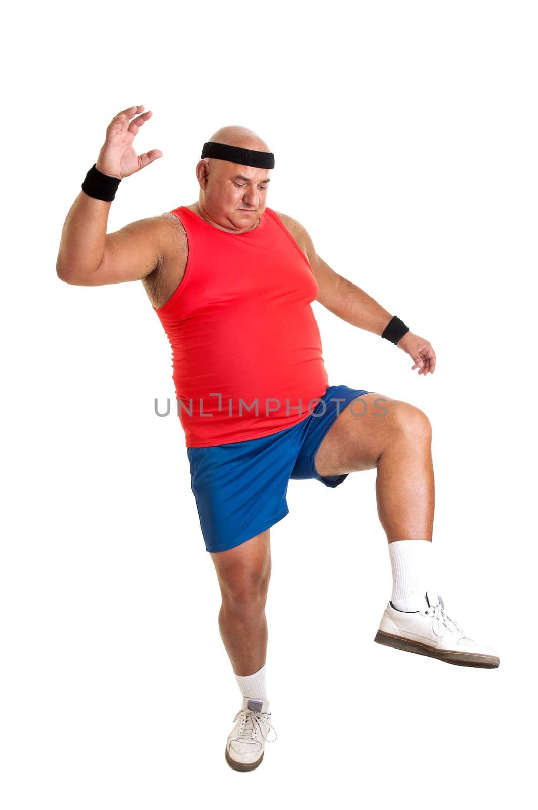 Large fitness man doing exercices isolated in white