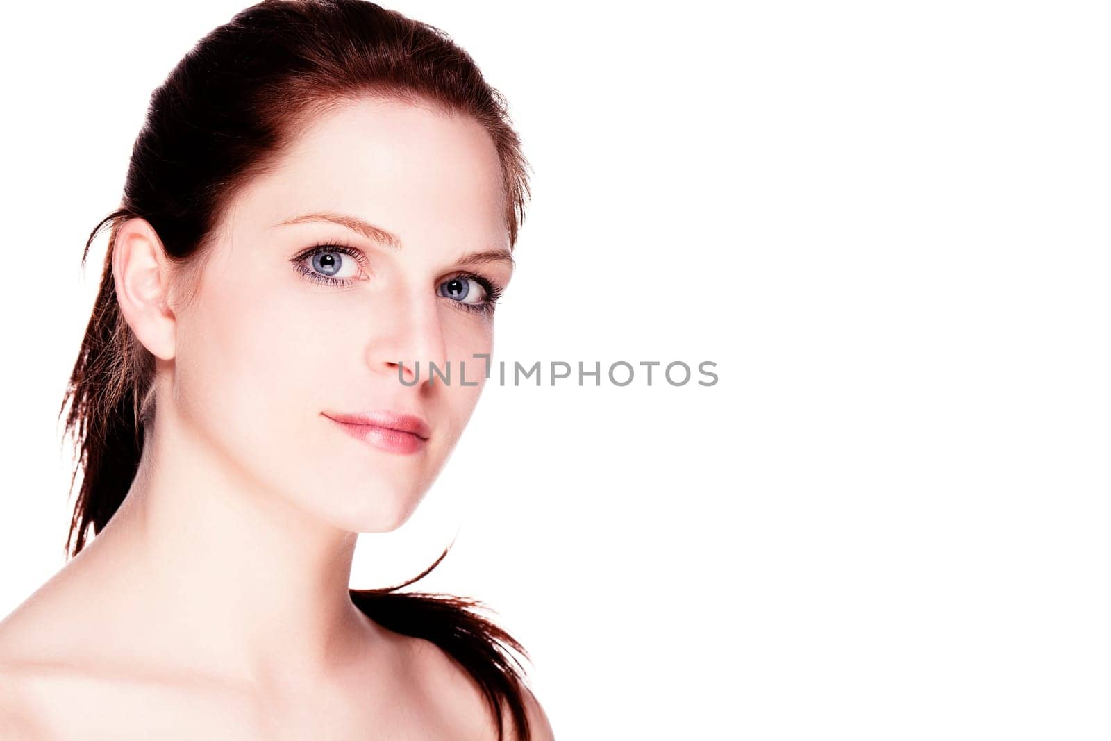 Wellness portrait of a beautiful young woman against a white background