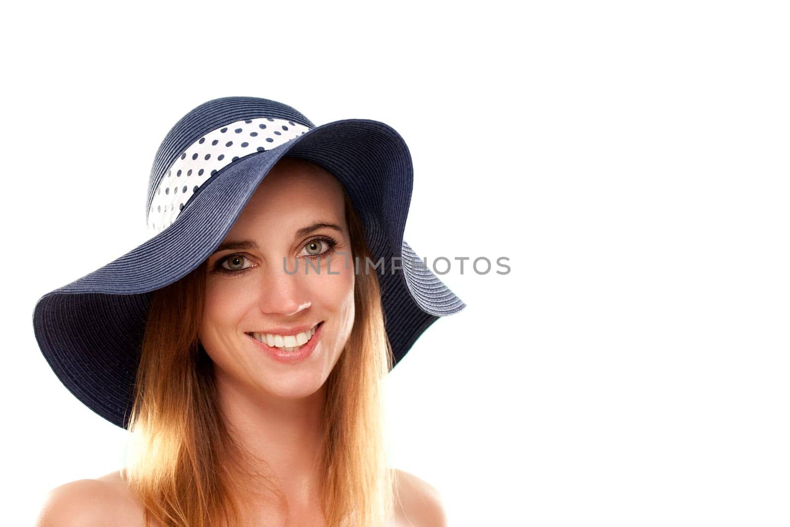 Portrait of a woman with summer hat against white background