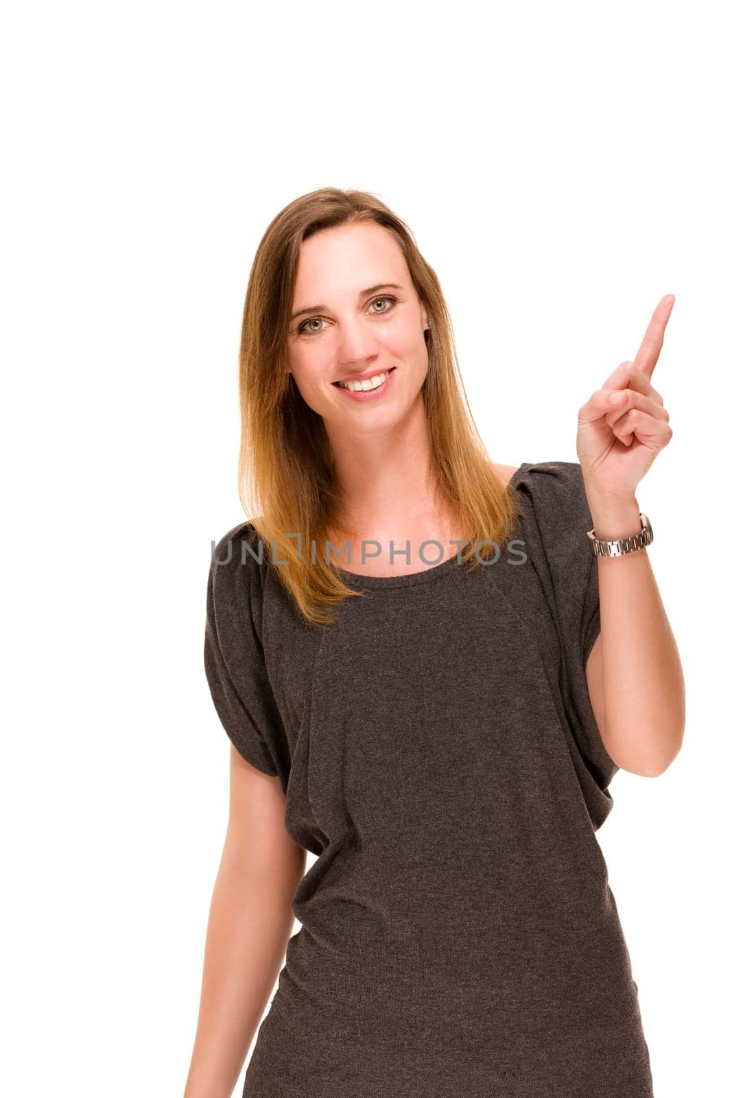 Satisfied woman pointing finger up against white background