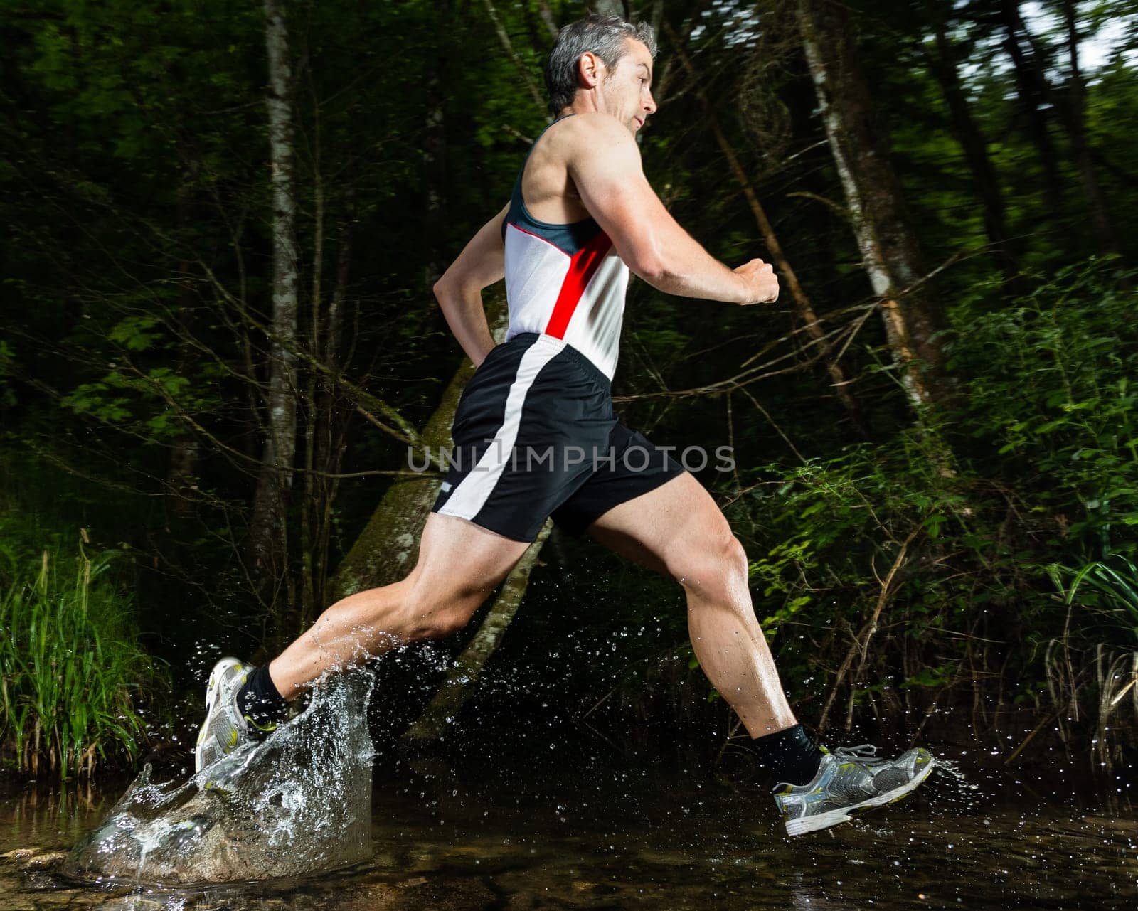 Jogger crosses creek bed
