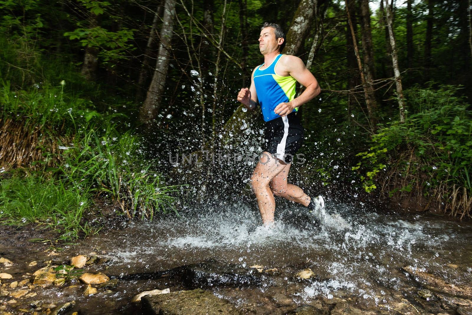 Jogger crosses creek bed