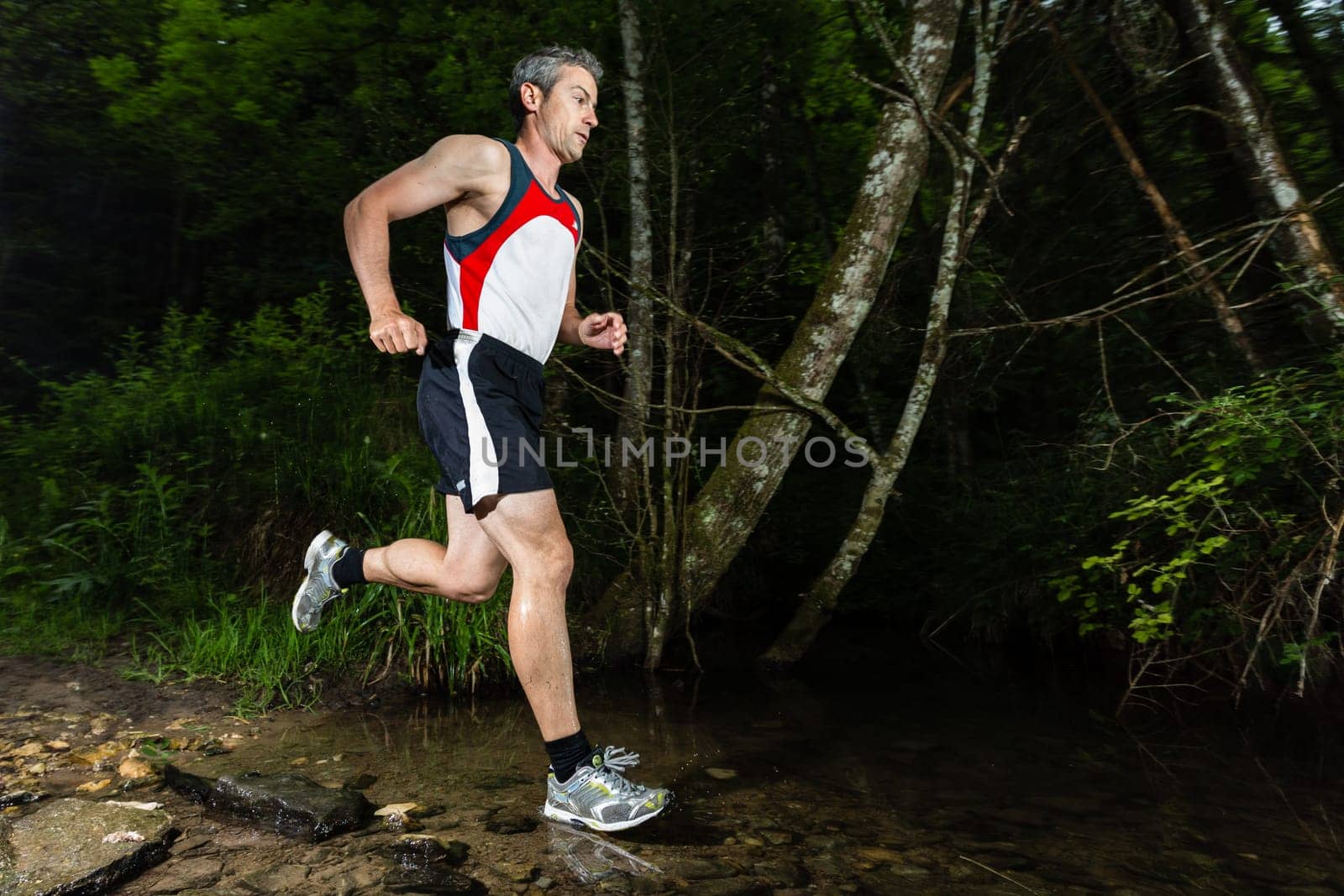 Jogger crosses creek bed