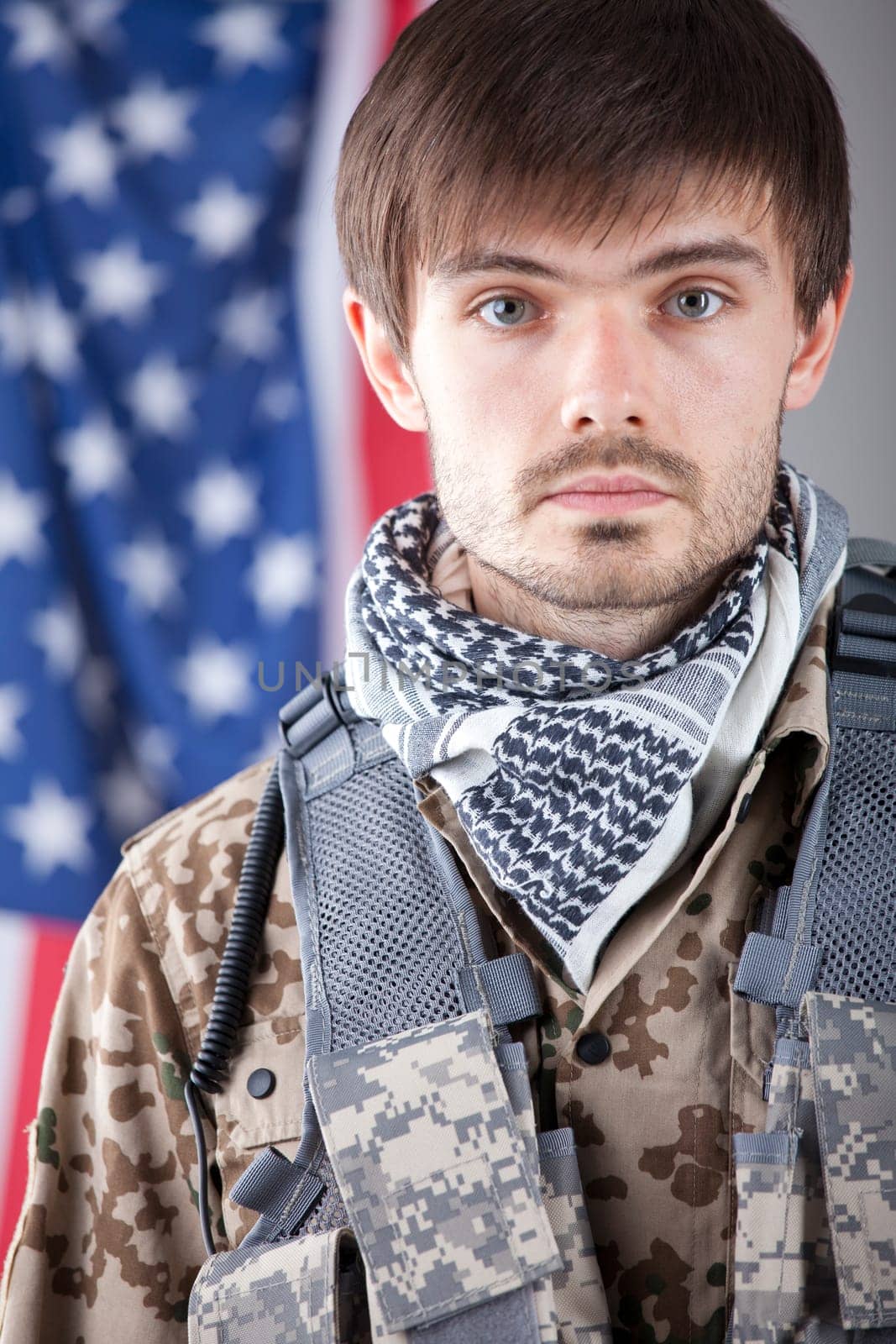 Portrait of tired soldier over american flag