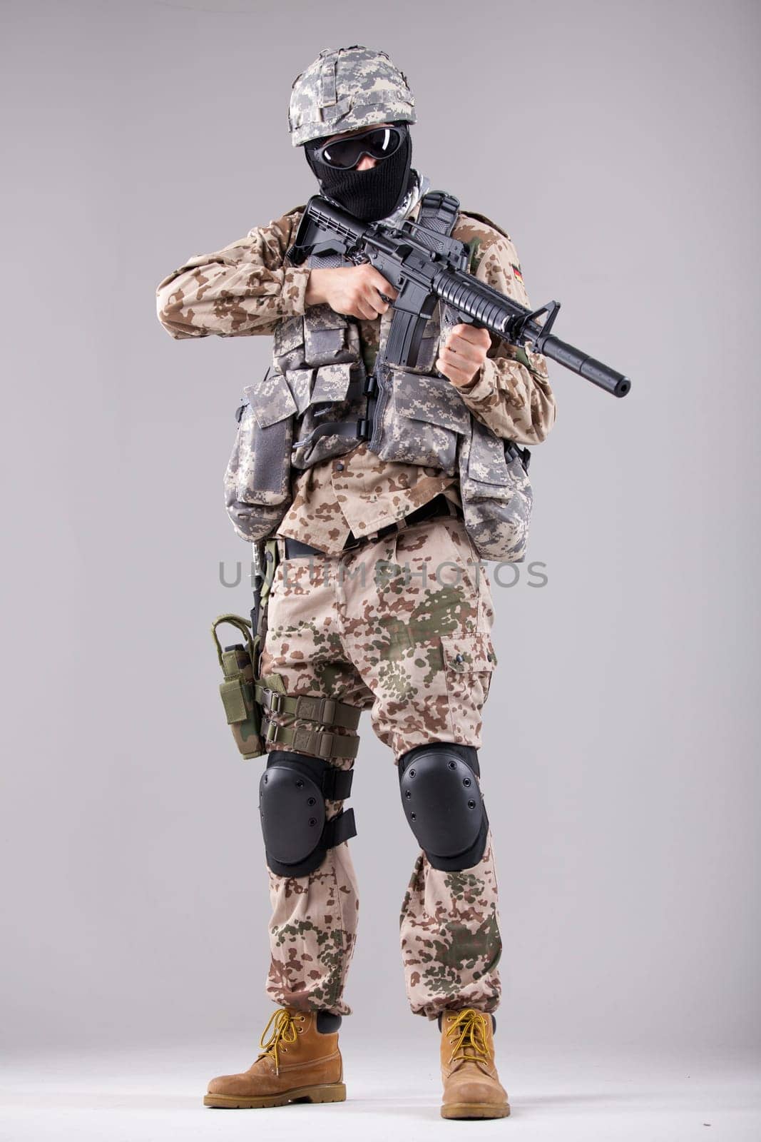 Military man, terrorist or soldier in camouflage with machine gun