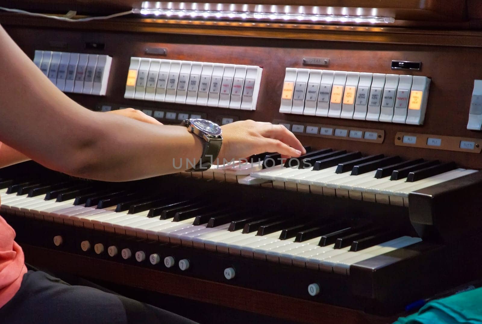 Musician playing on keyboards.