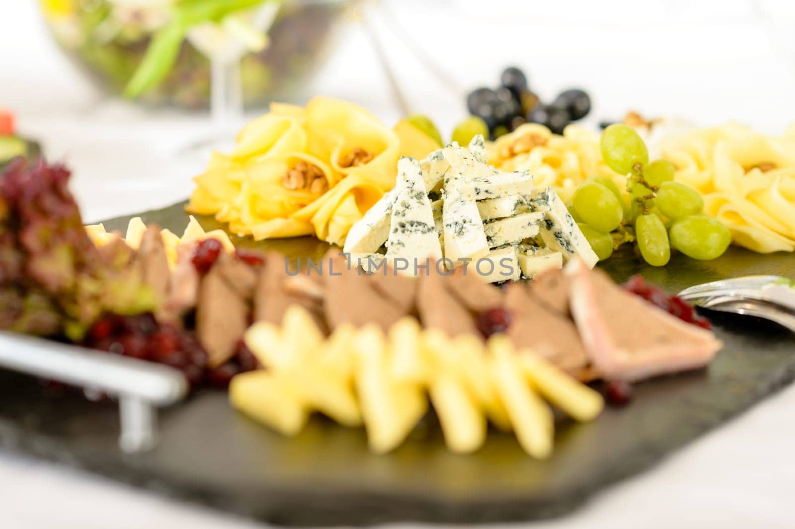 Catering buffet cheeseboard and pate, grapes and walnuts cheeseboard