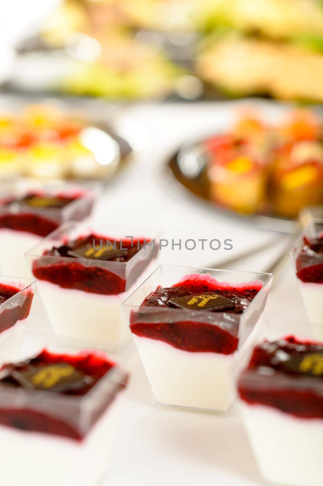 Appetizers mini desserts on catering buffet white tablecloth