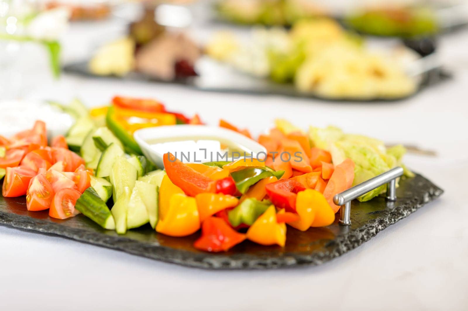 Catering table buffet full of tasty food vegetable salad plate