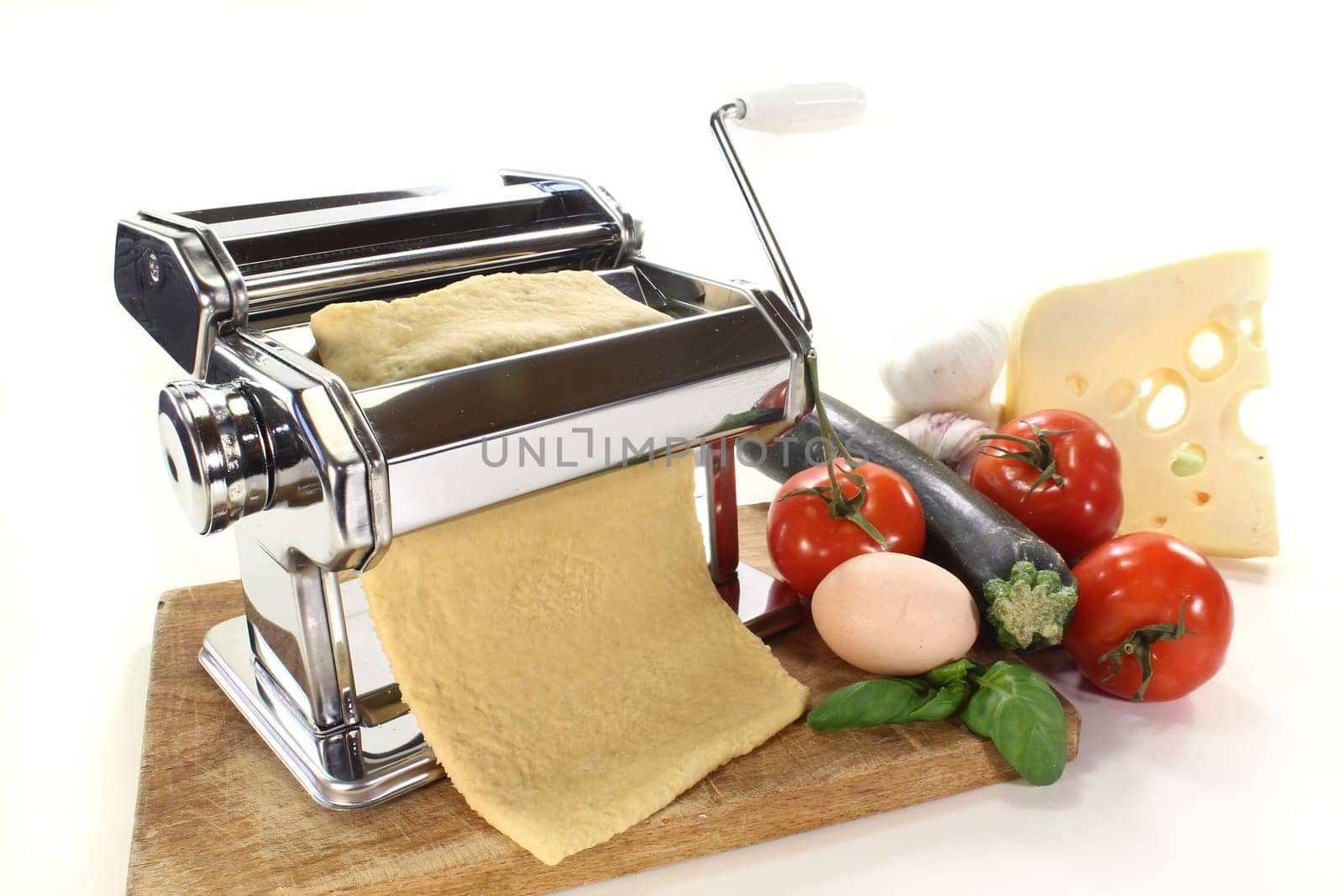 a pasta machine with homemade pasta dough