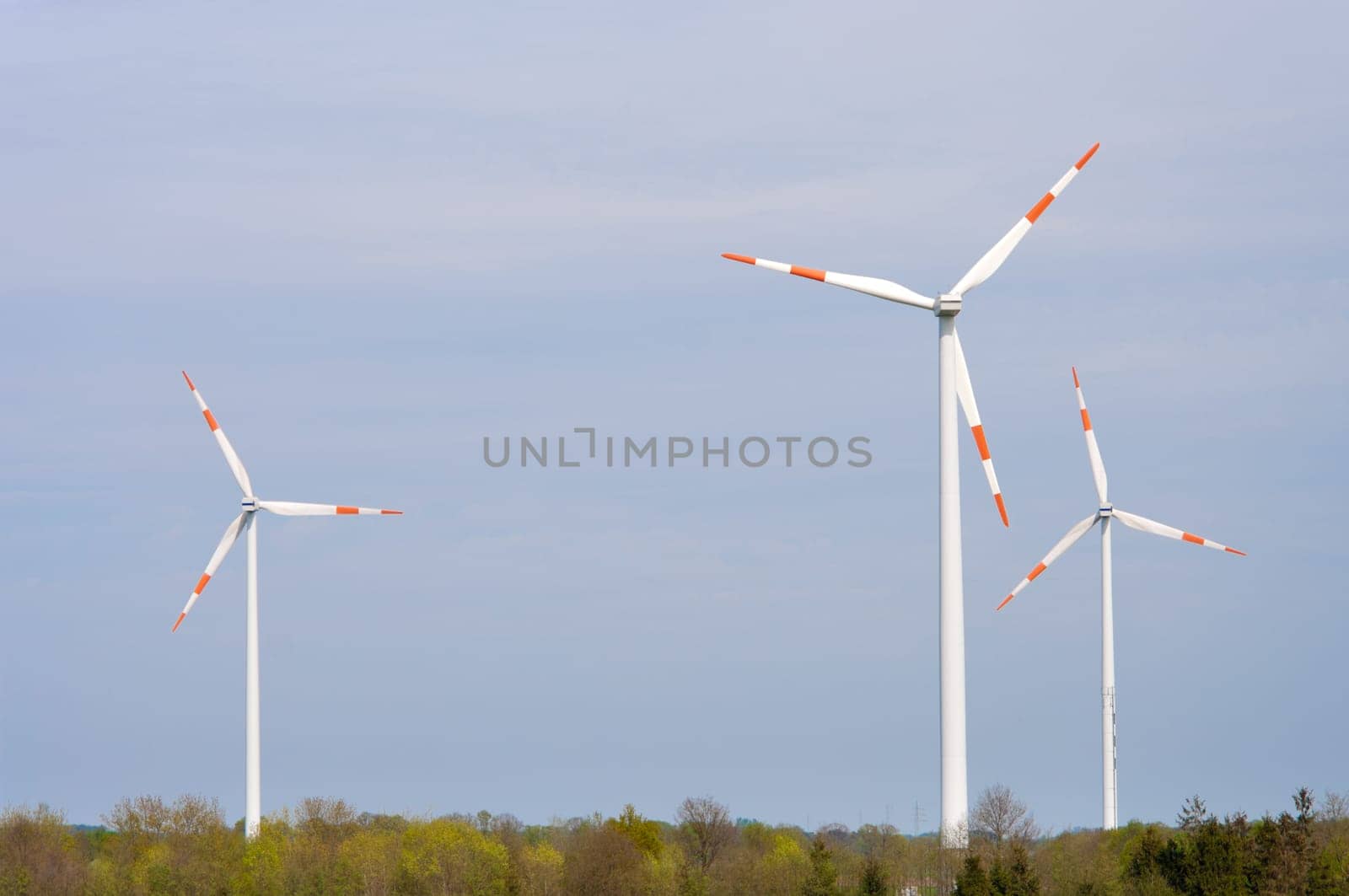 several windmills in a rural landscape
