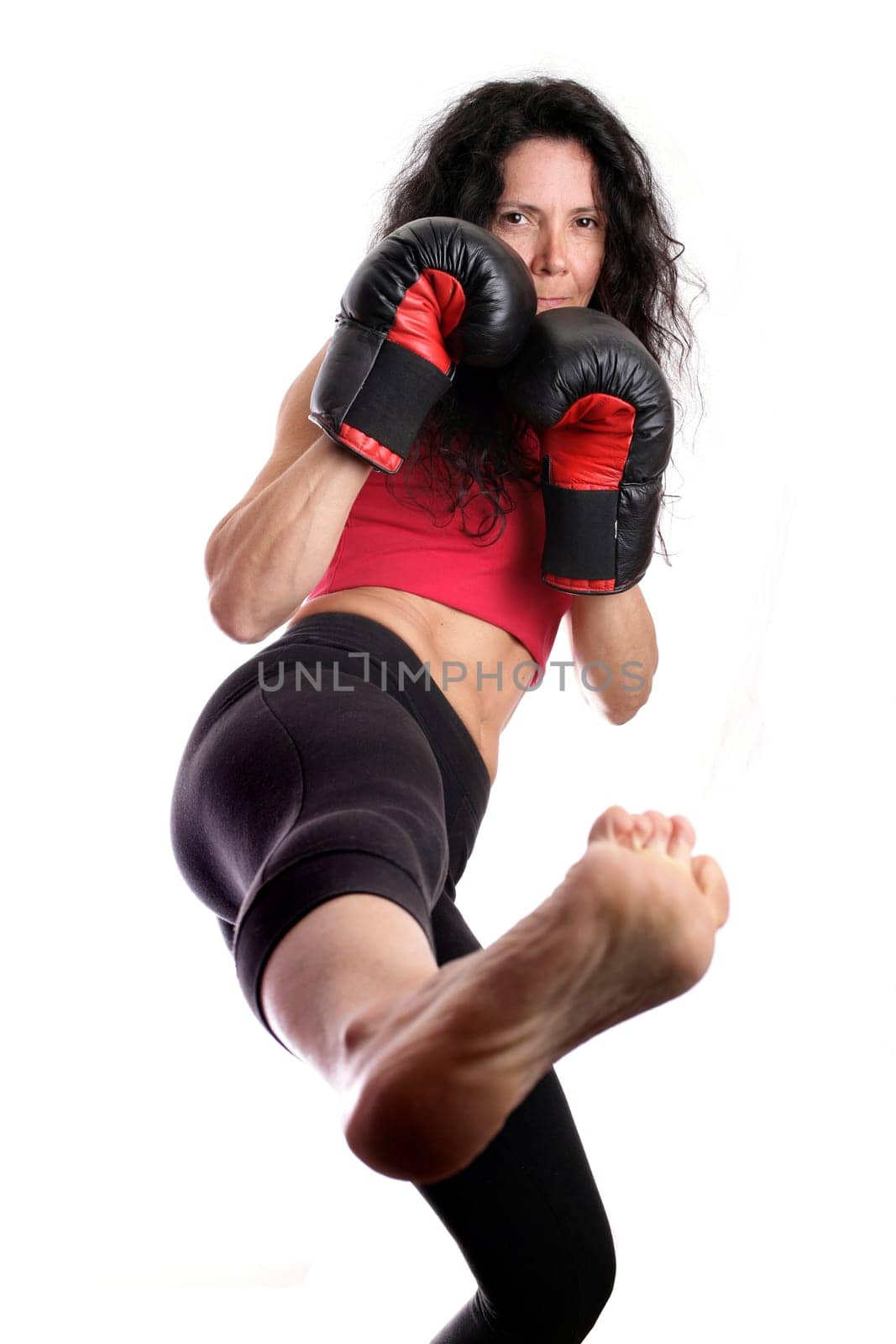 Young girl with boxing glove isolated in white