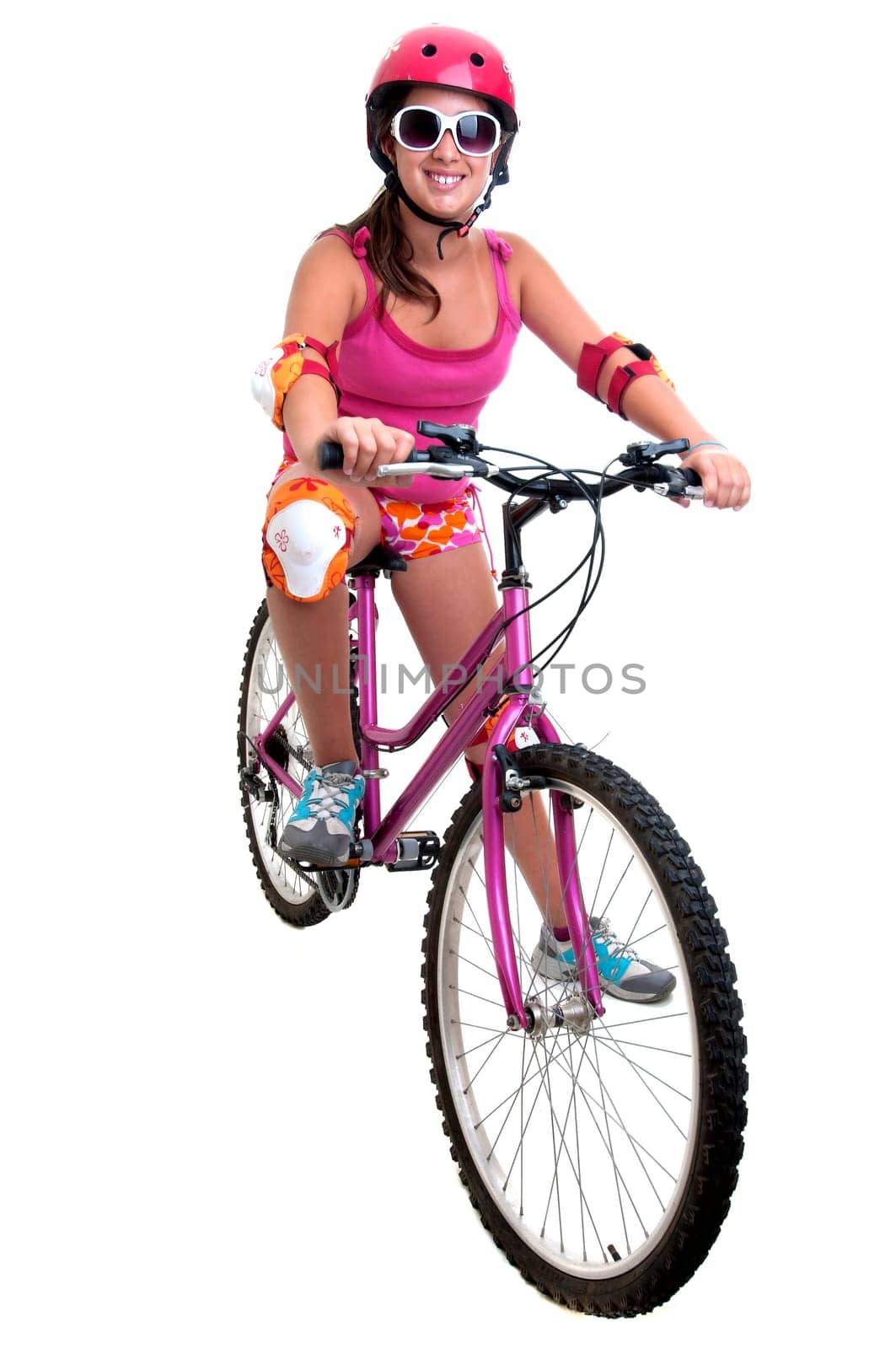 Beautiful young girl with a bicycle isolated in white