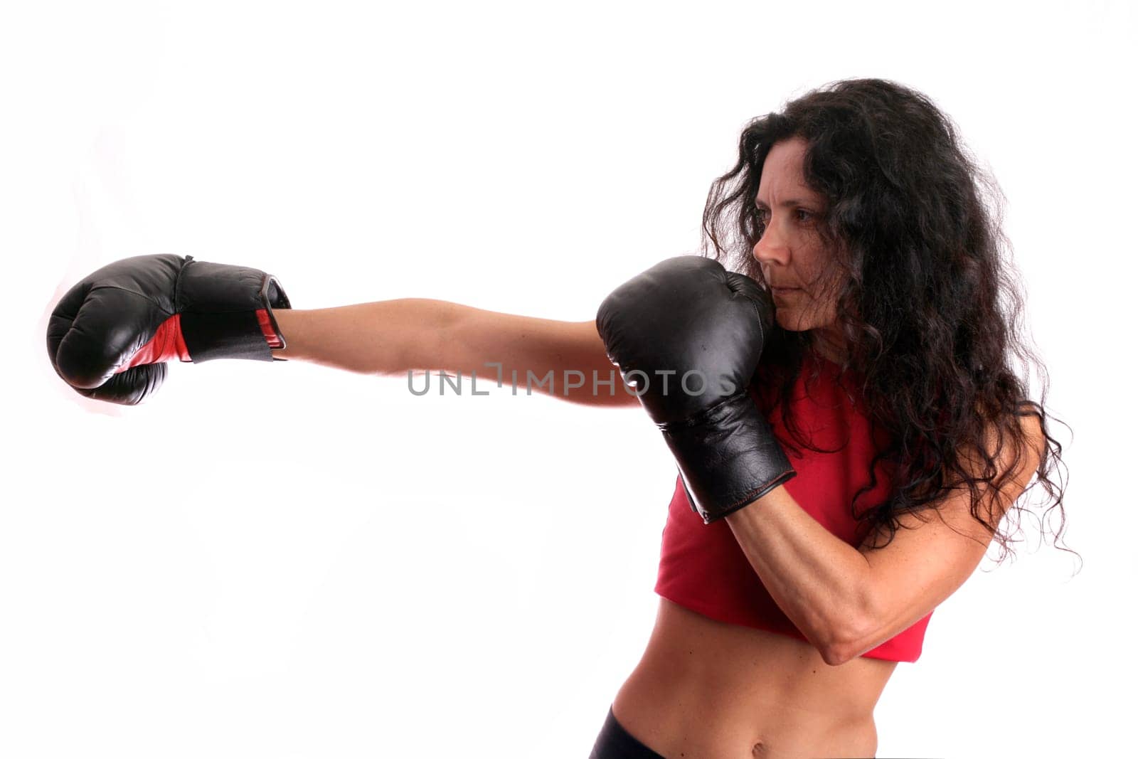 Young girl with boxing glove isolated in white