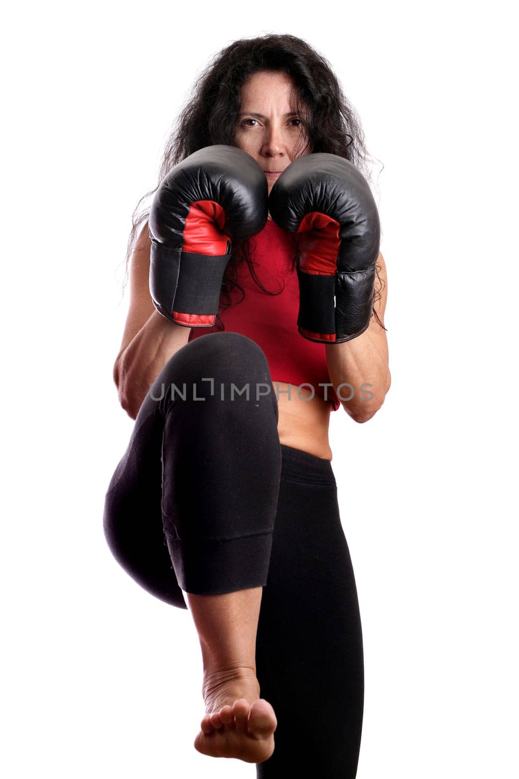 Young girl with boxing glove isolated in white