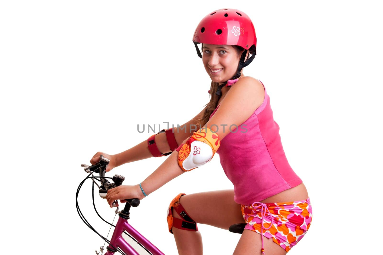 Beautiful young girl with a bicycle isolated in white