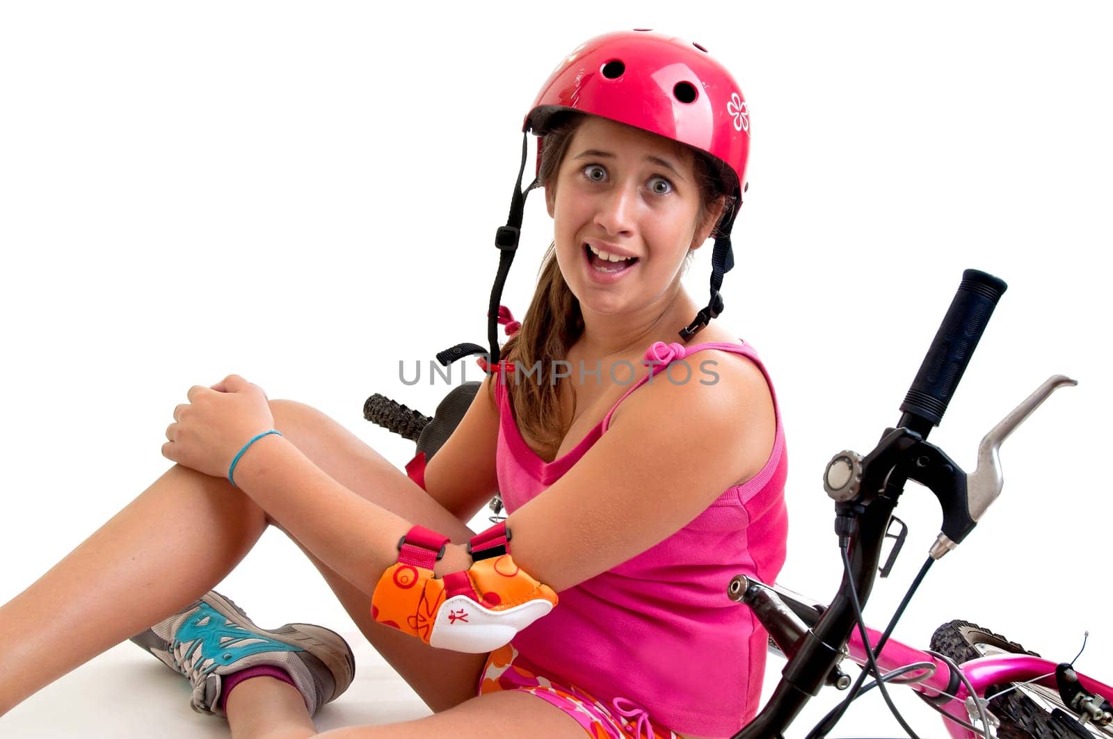 Beautiful young girl in a bicycle crash isolated in white
