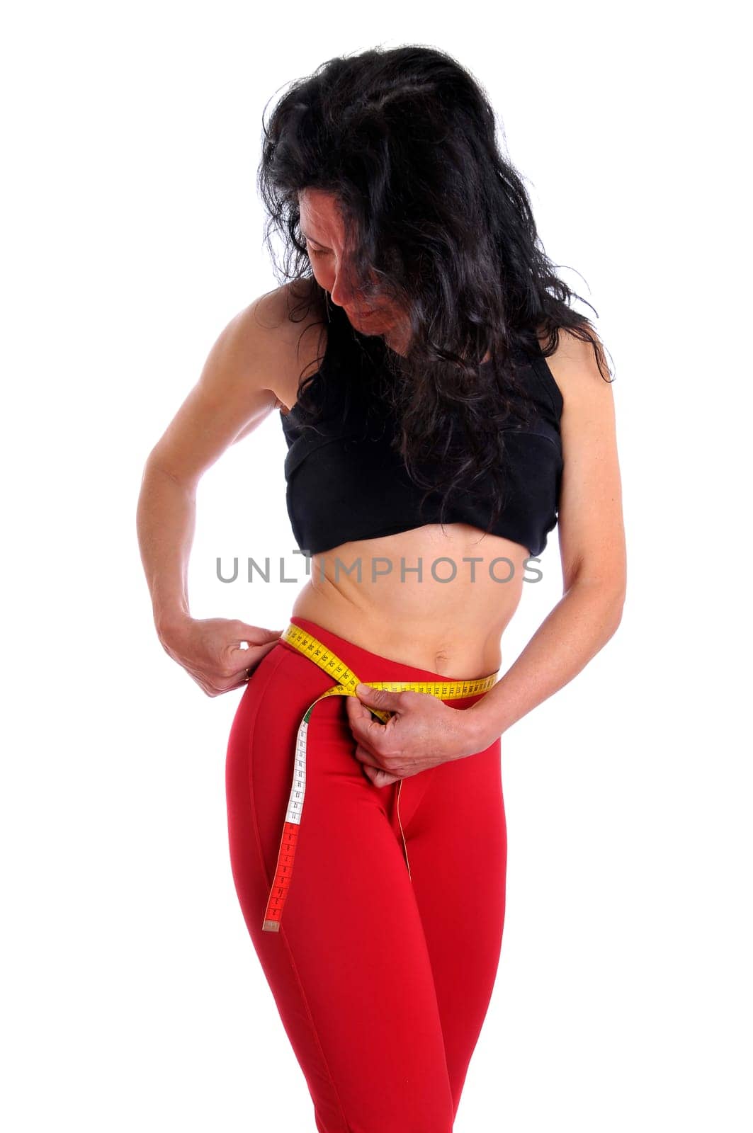 Mature fit woman with measuring tape isolated in white