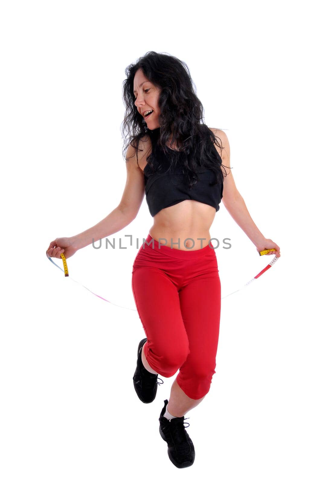 Mature fit woman with measuring tape isolated in white