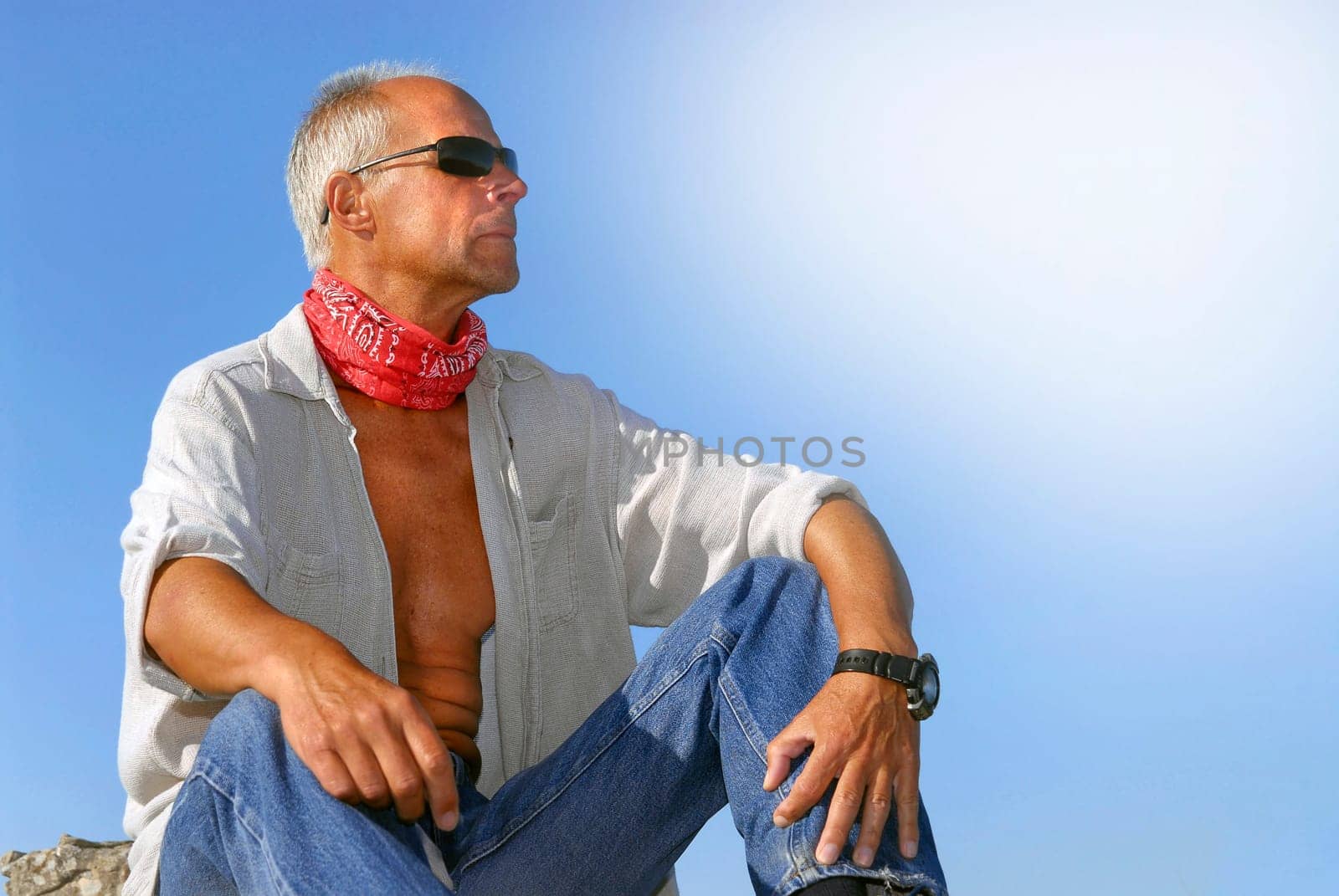 Handsome mature man adventurer posing outdoors