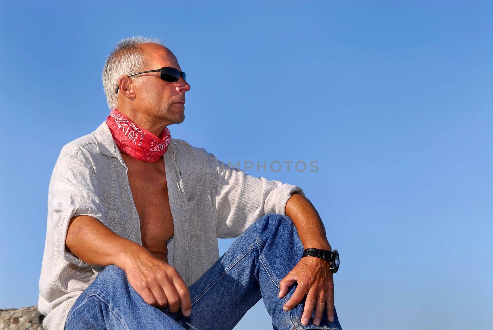 Handsome mature man adventurer posing outdoors