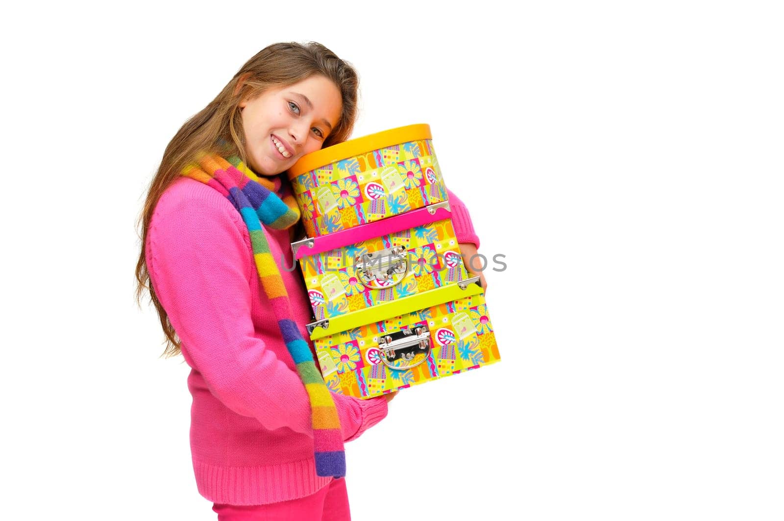 Beautiful young girl with present boxes isolated in white