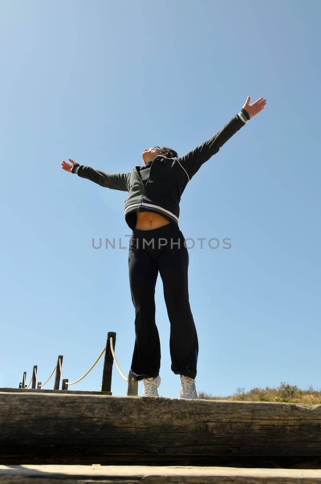 Woman jumping high outdoors