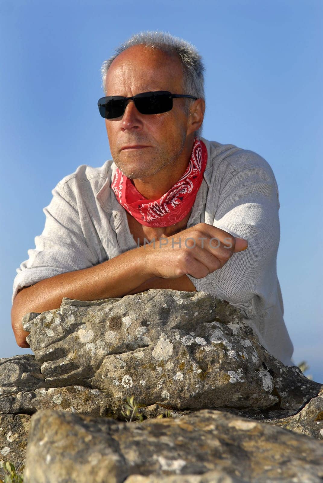Handsome mature man adventurer posing outdoors