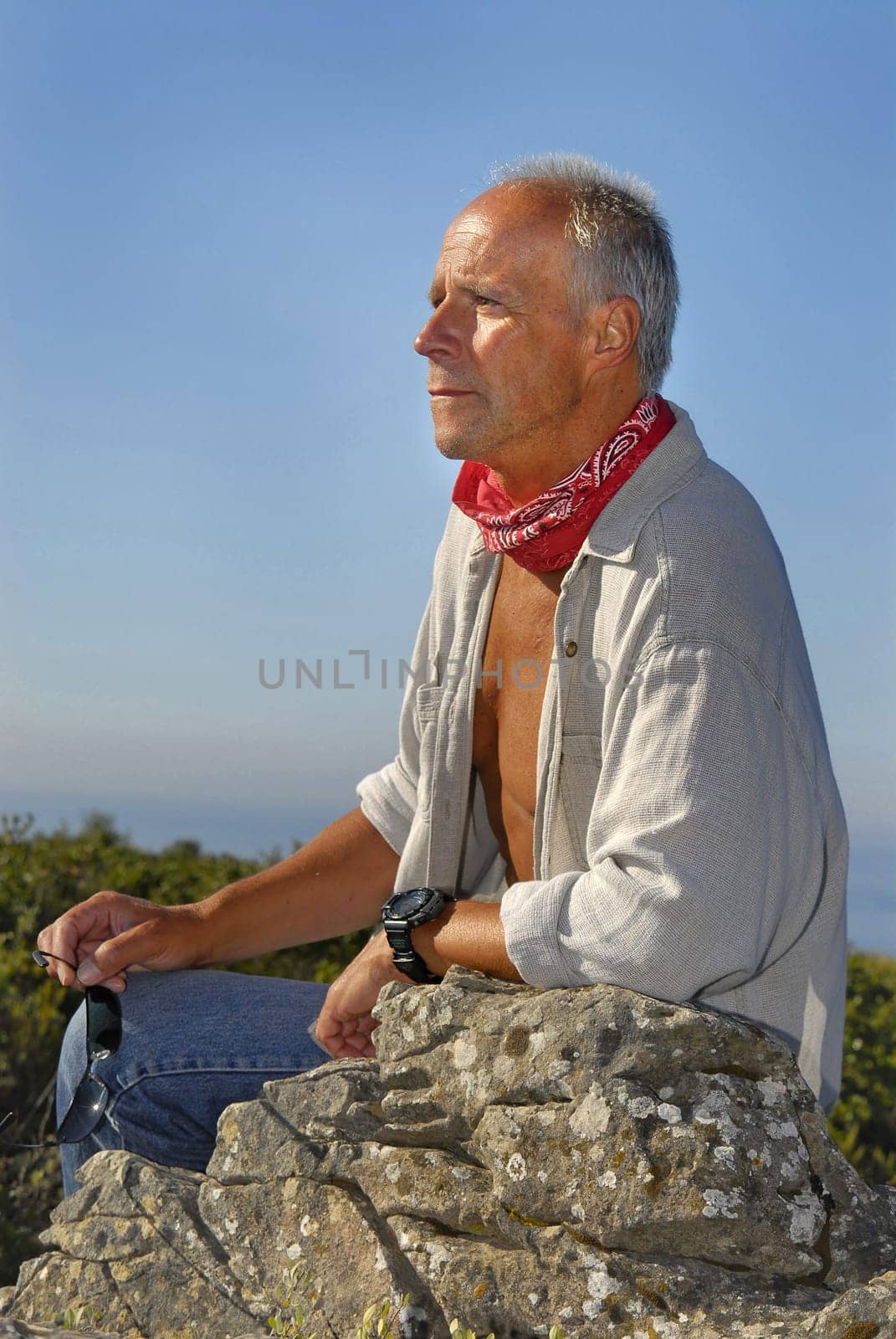 Handsome mature man adventurer posing outdoors