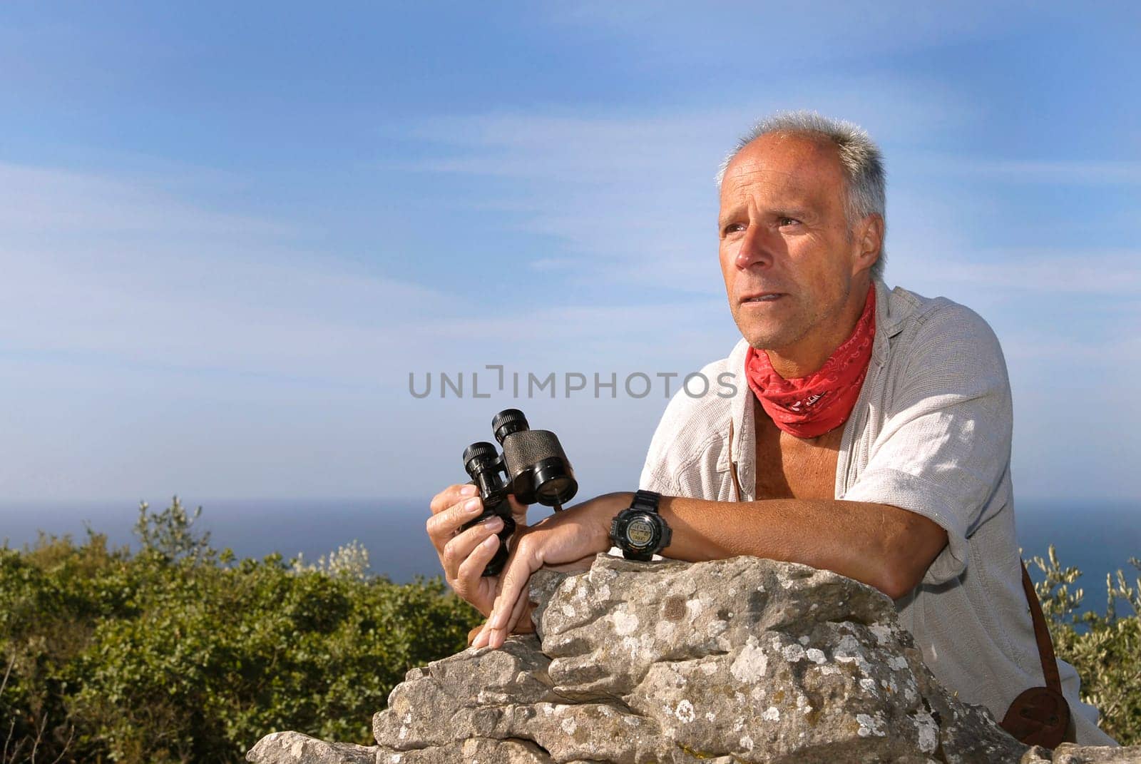 Explorer with is binoculars looking for adventure