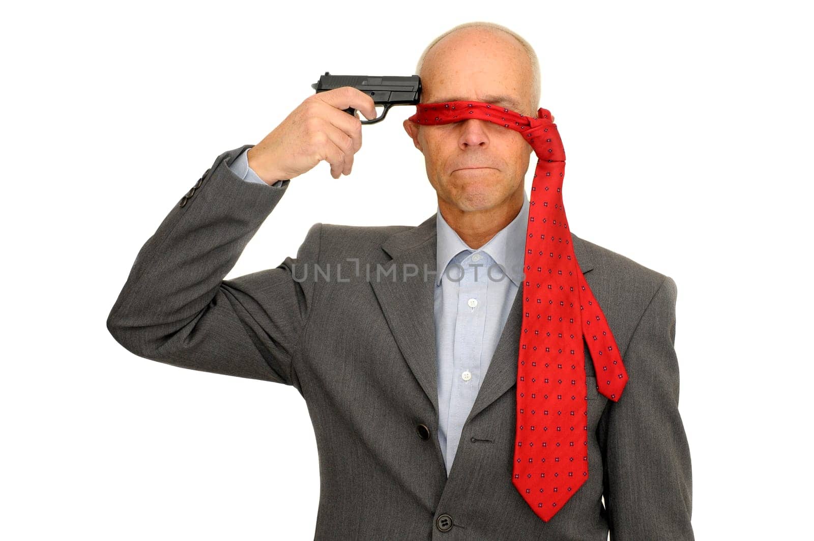 Mature man with a gun isolated in white