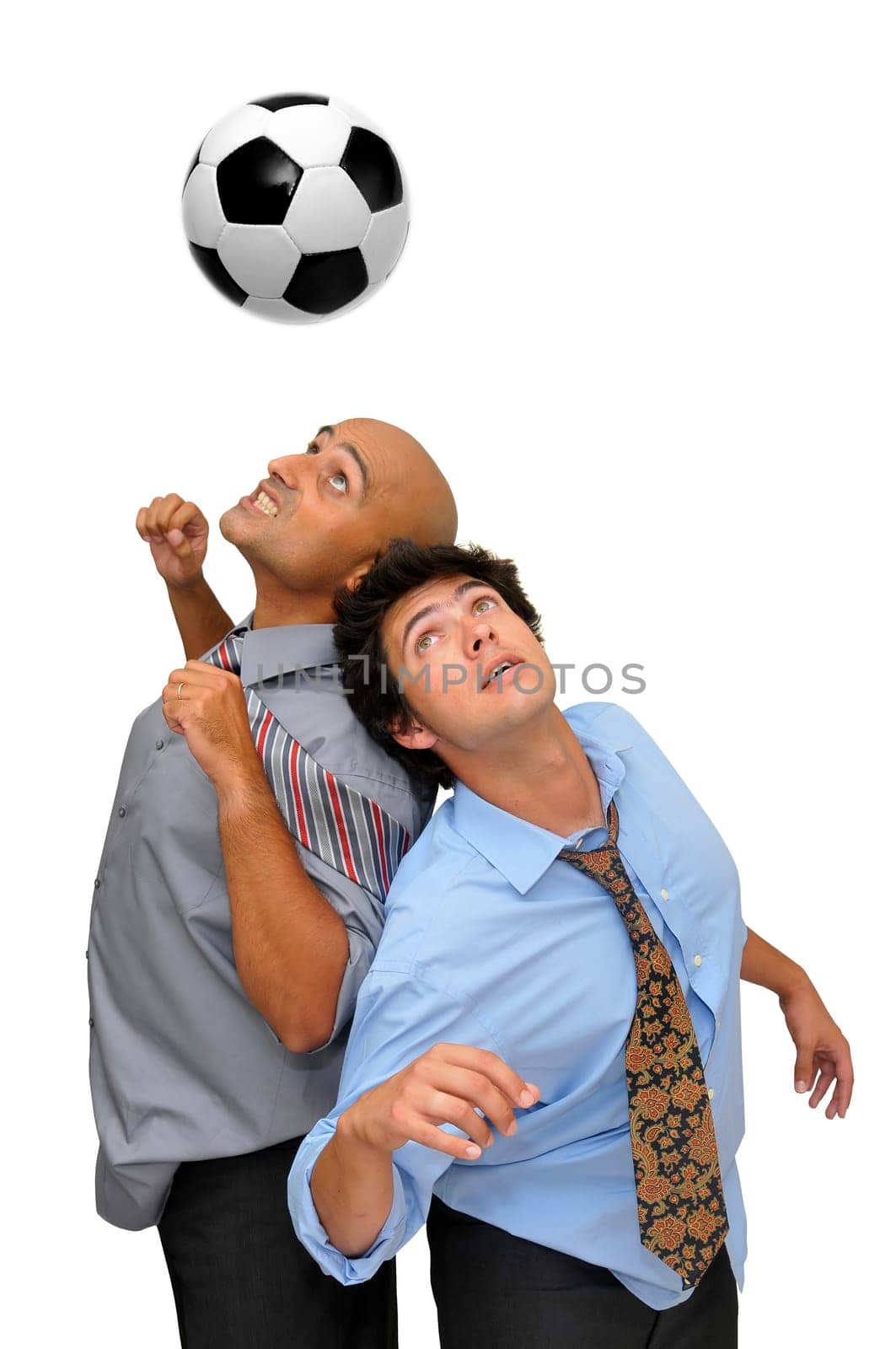 Two businessmen fighting in a soccer game isolated in white