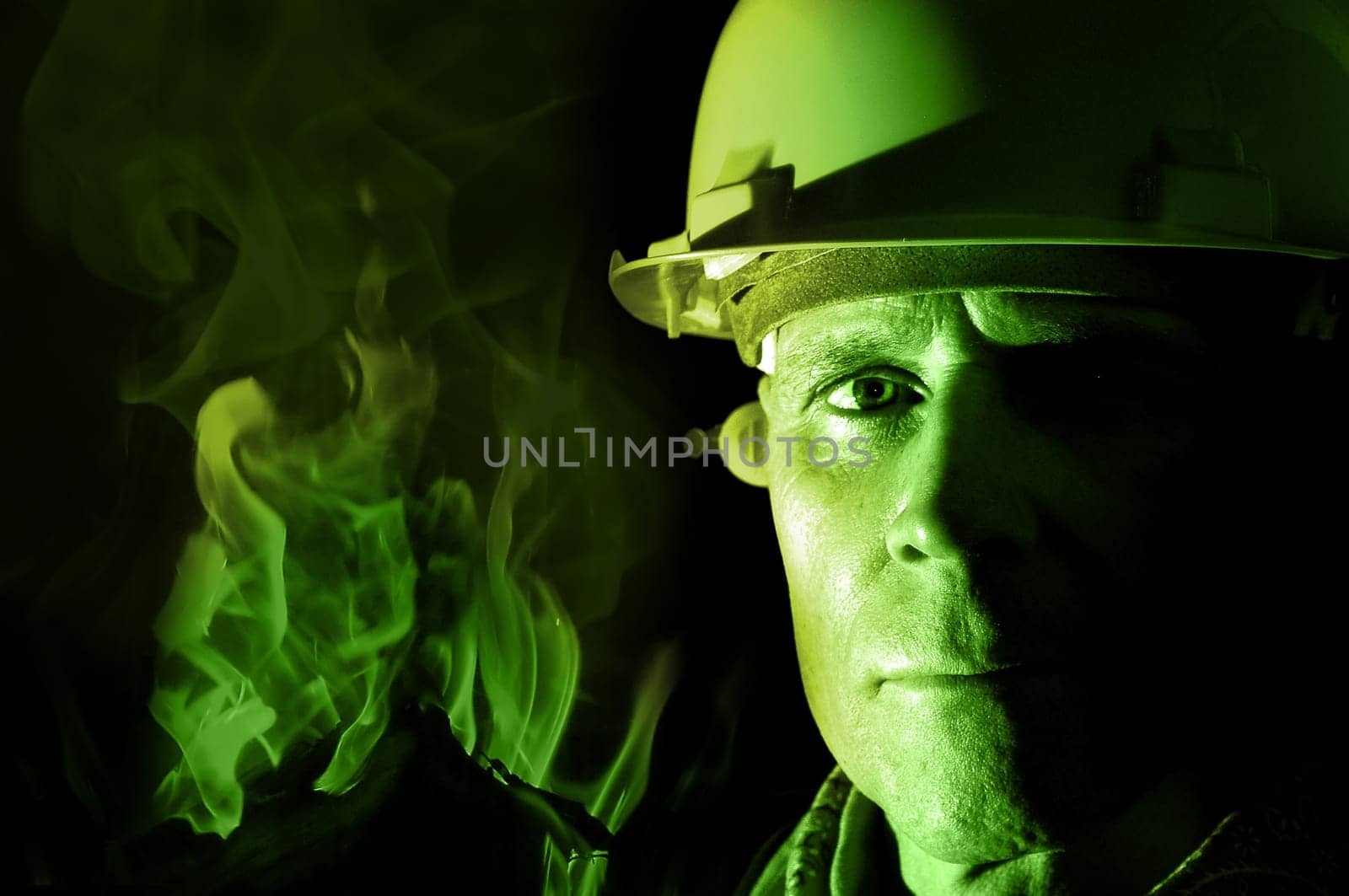 Portrait of a firemanr isolated in black
